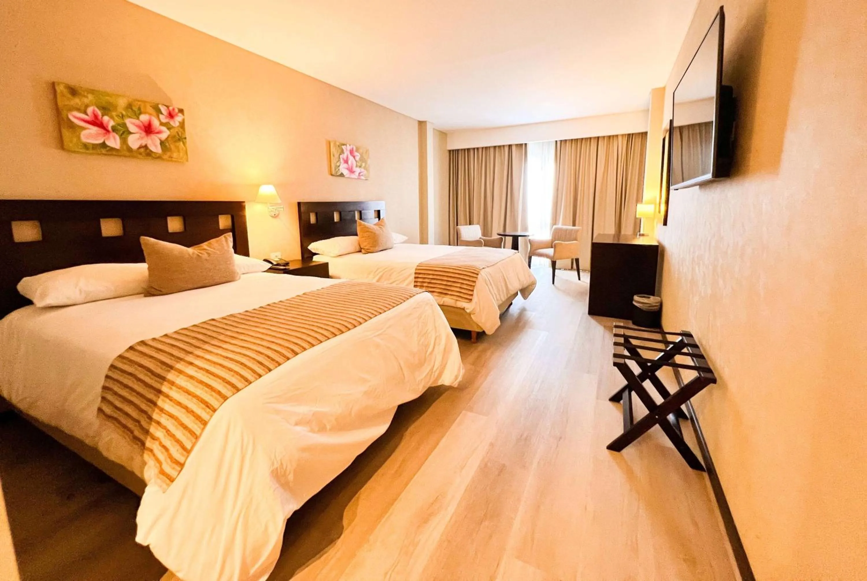 Photo of the whole room, Bed in Howard Johnson Hotel & Resort Funes