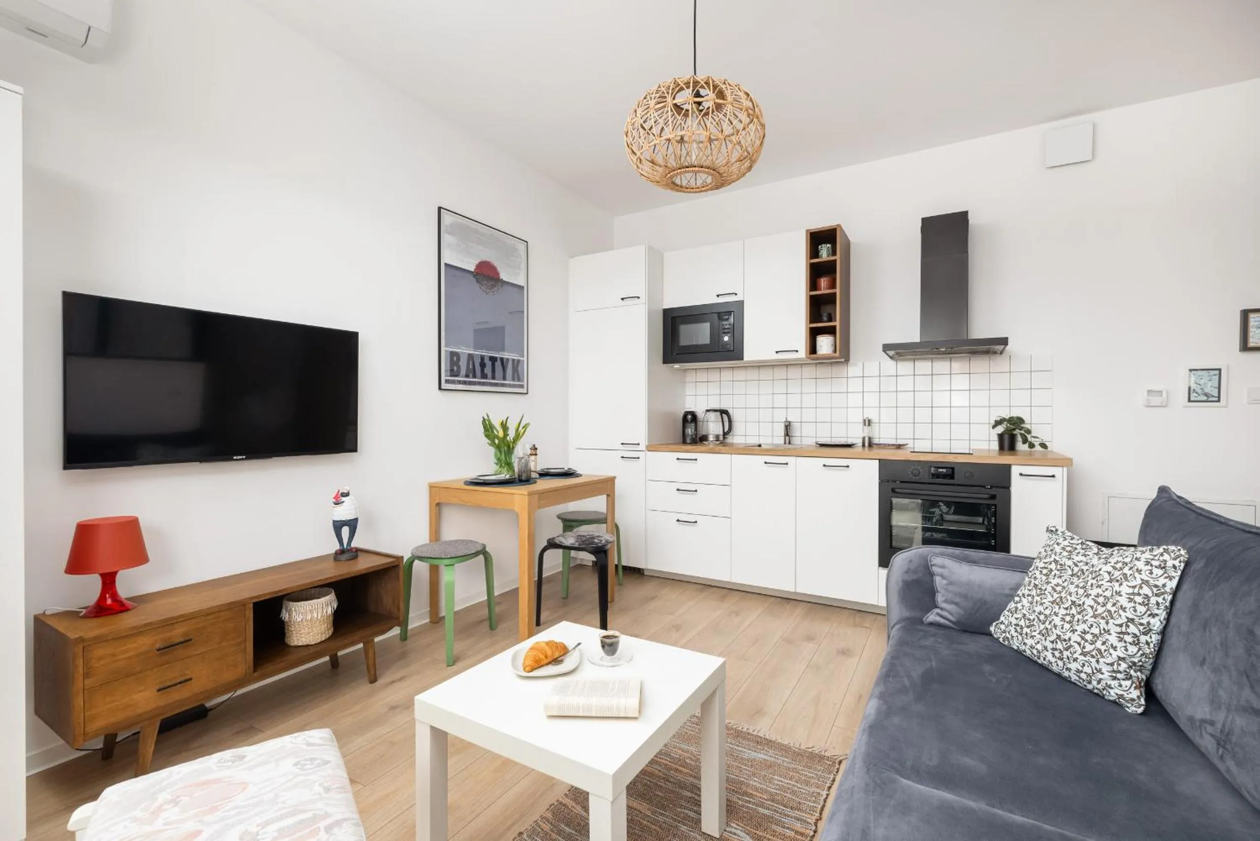 Seating area in Szprotka Apartment with Air-Conditioning & Parking by Noclegi Renters