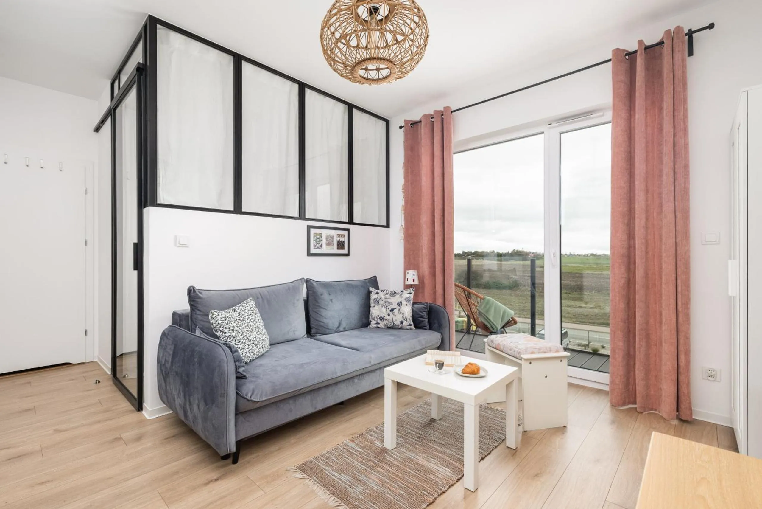 Seating area in Szprotka Apartment with Air-Conditioning & Parking by Noclegi Renters