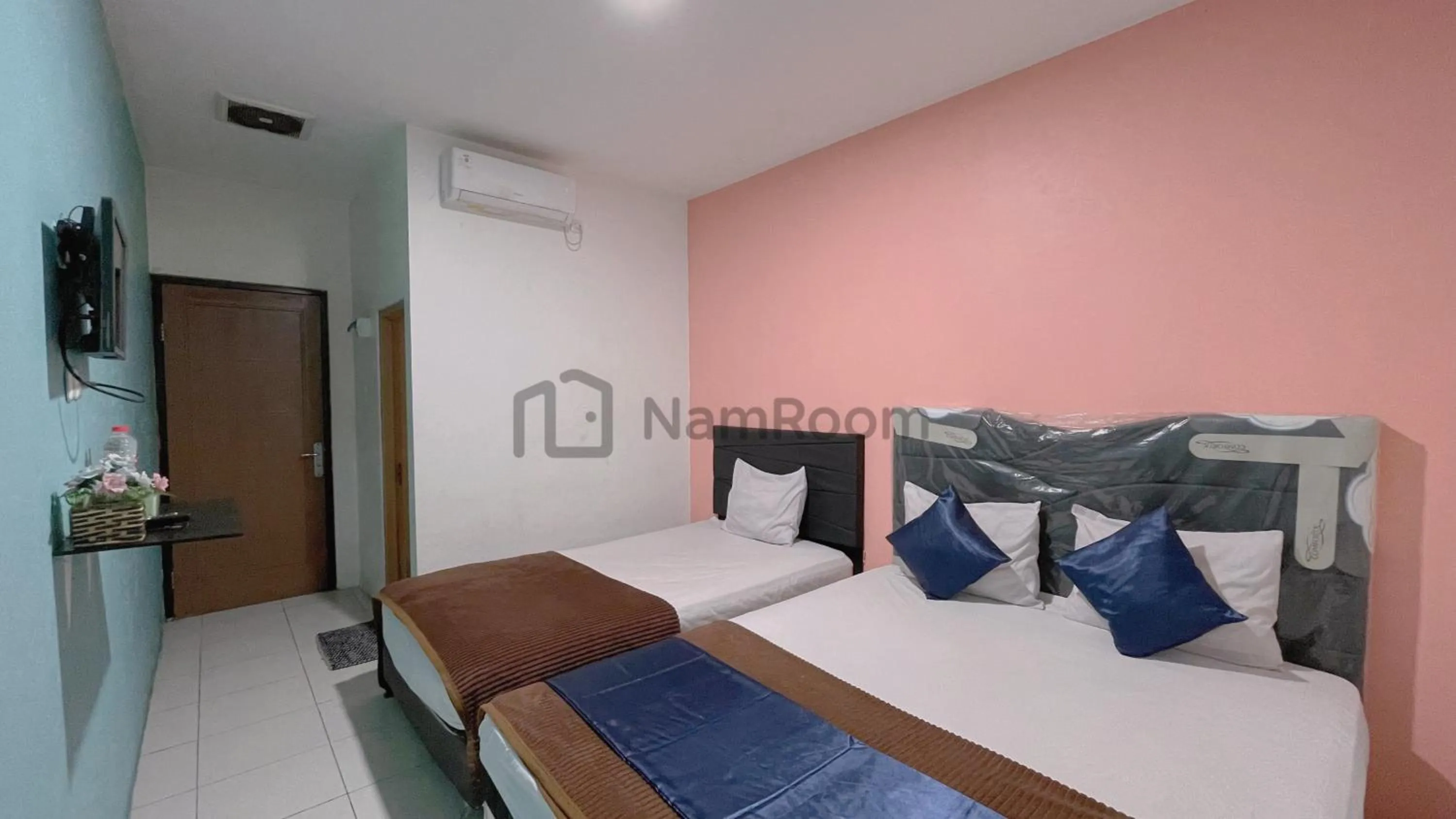 Bed in Cempaka Residence By NamRoom