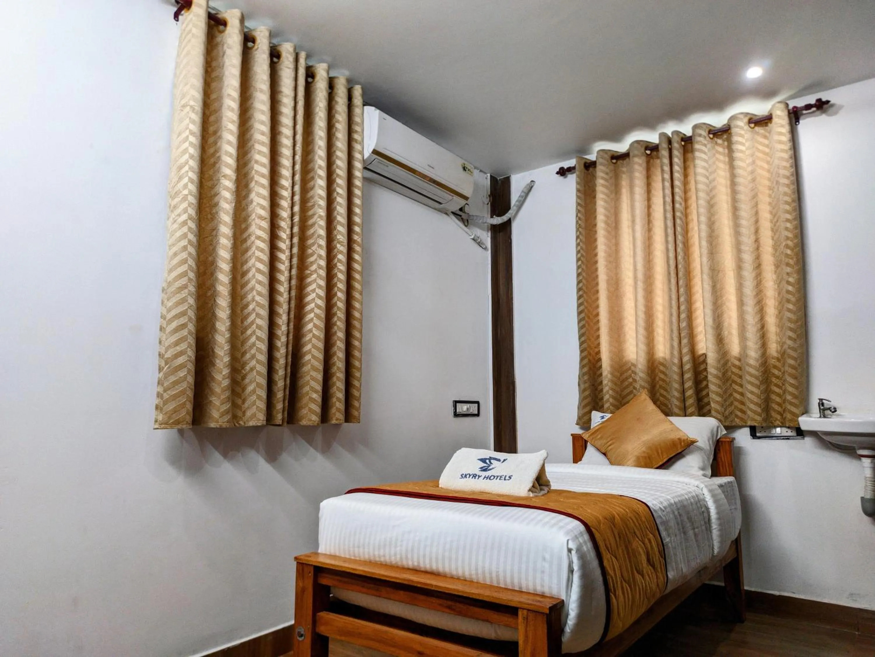 Bed in Skyry Hotels Singanallur