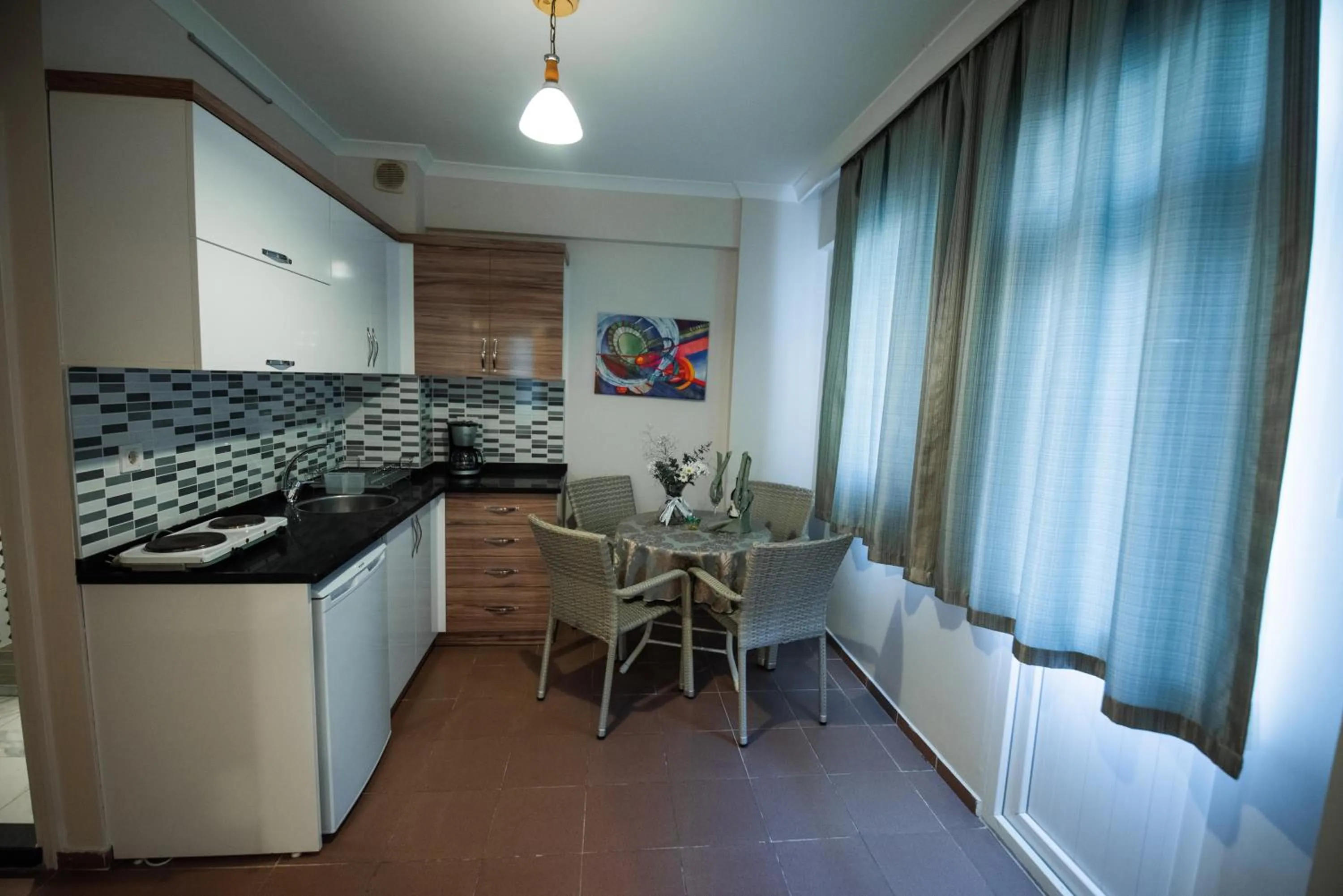 Kitchen or kitchenette in Narcis Apart Hotel
