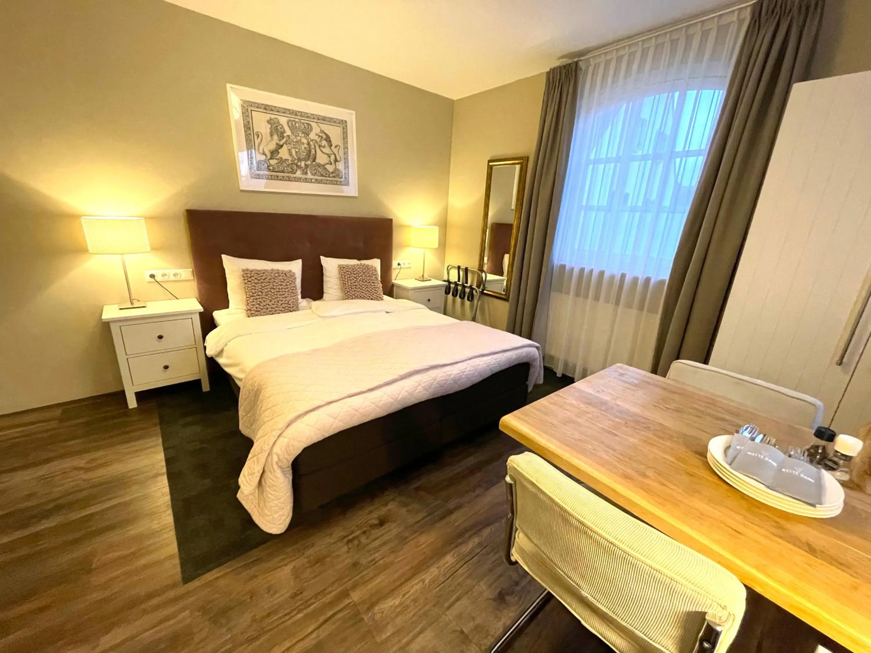 Bed in In de Witte Dame Hotel Bar Kitchen Apartments