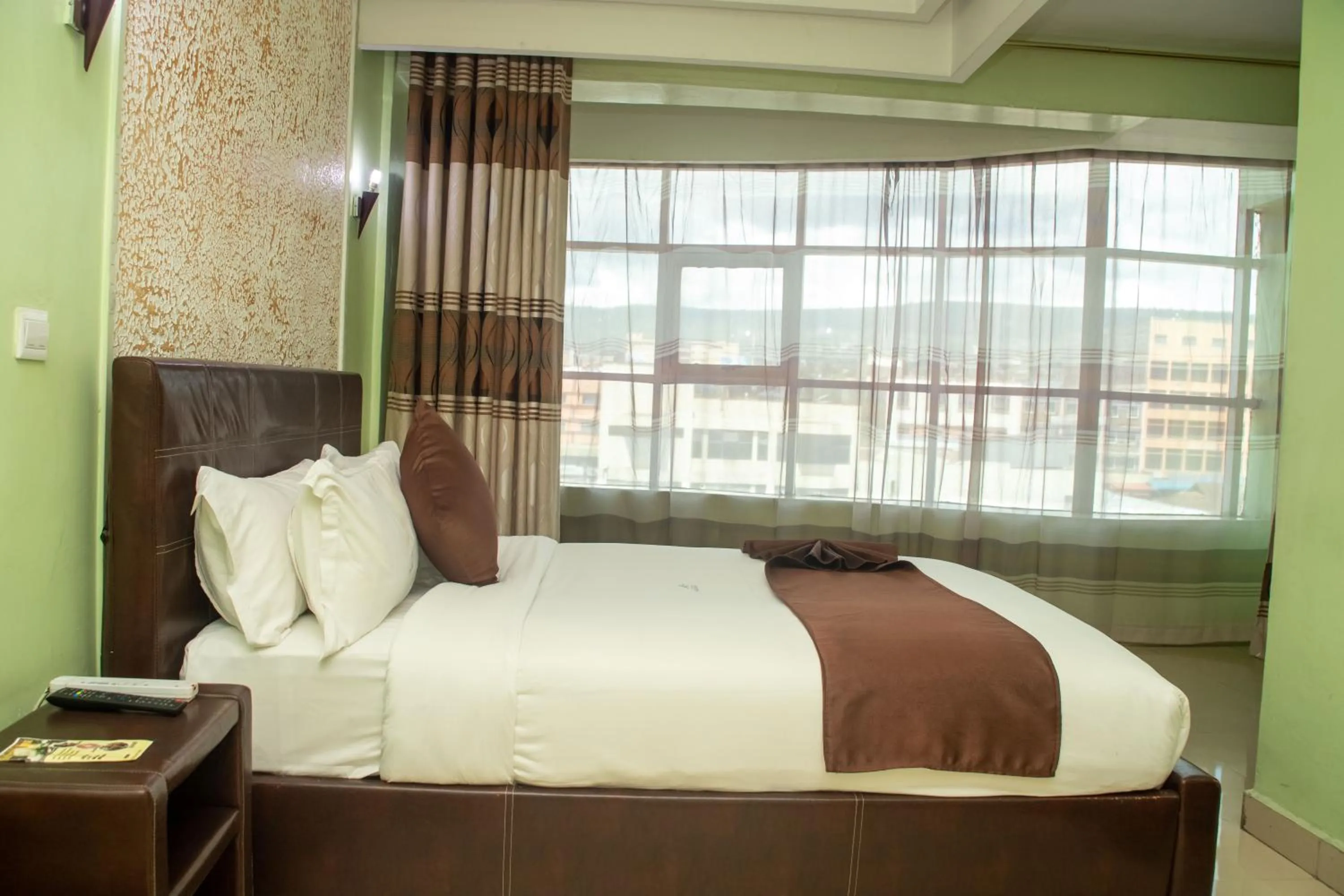Bed in Legacy Hotel and Conference Centre ltd