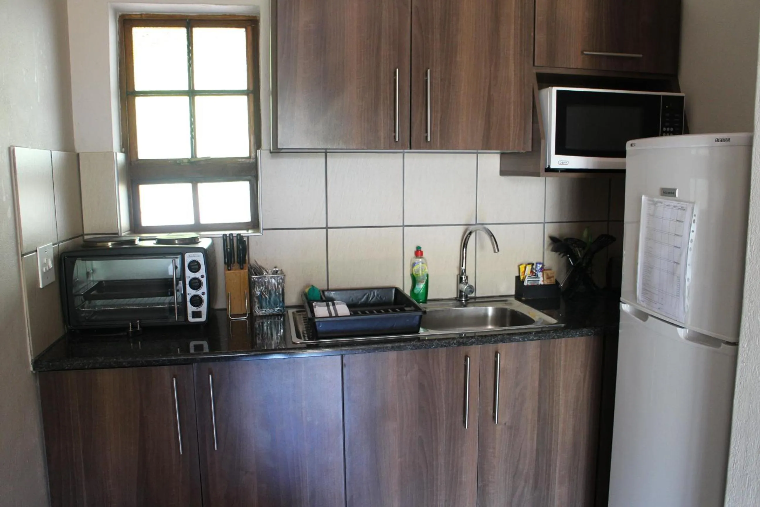 Kitchen or kitchenette in Cu Guest House
