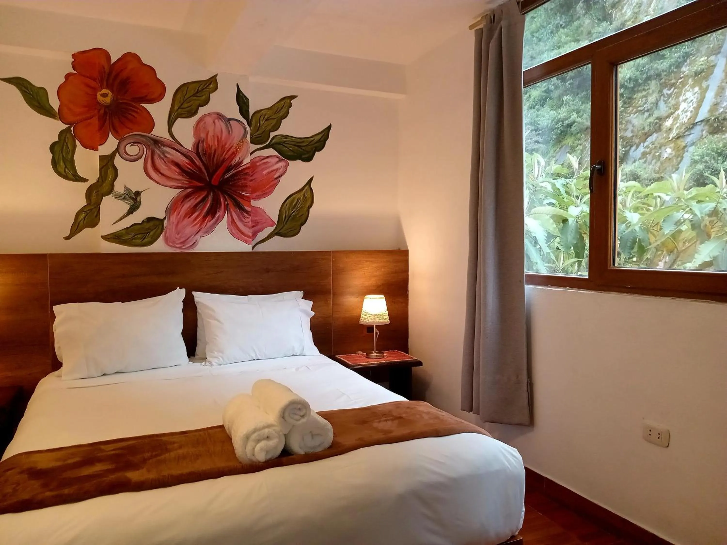 Bed in Susanna Inn MachuPicchu Hotel