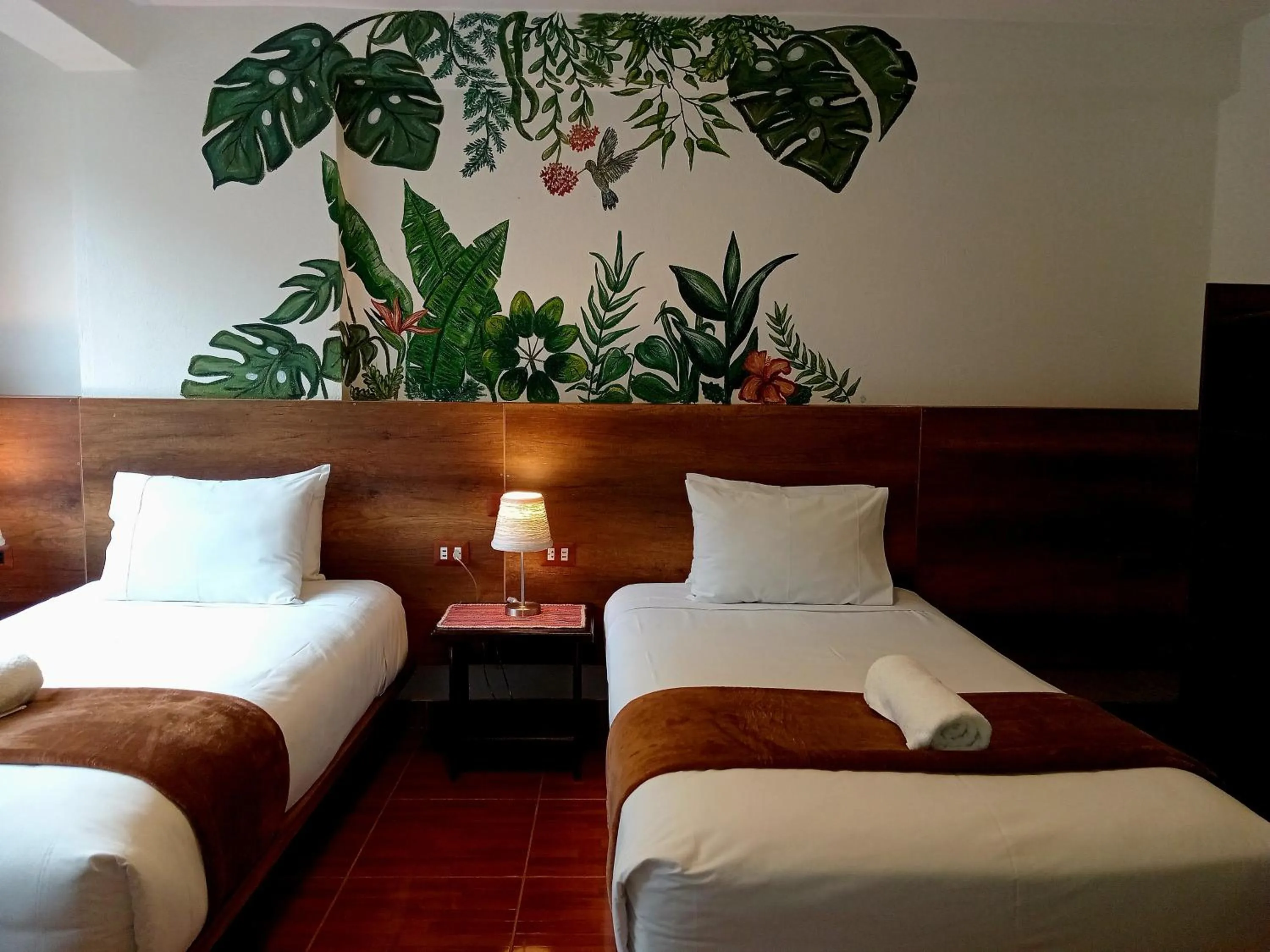 Bed in Susanna Inn MachuPicchu Hotel