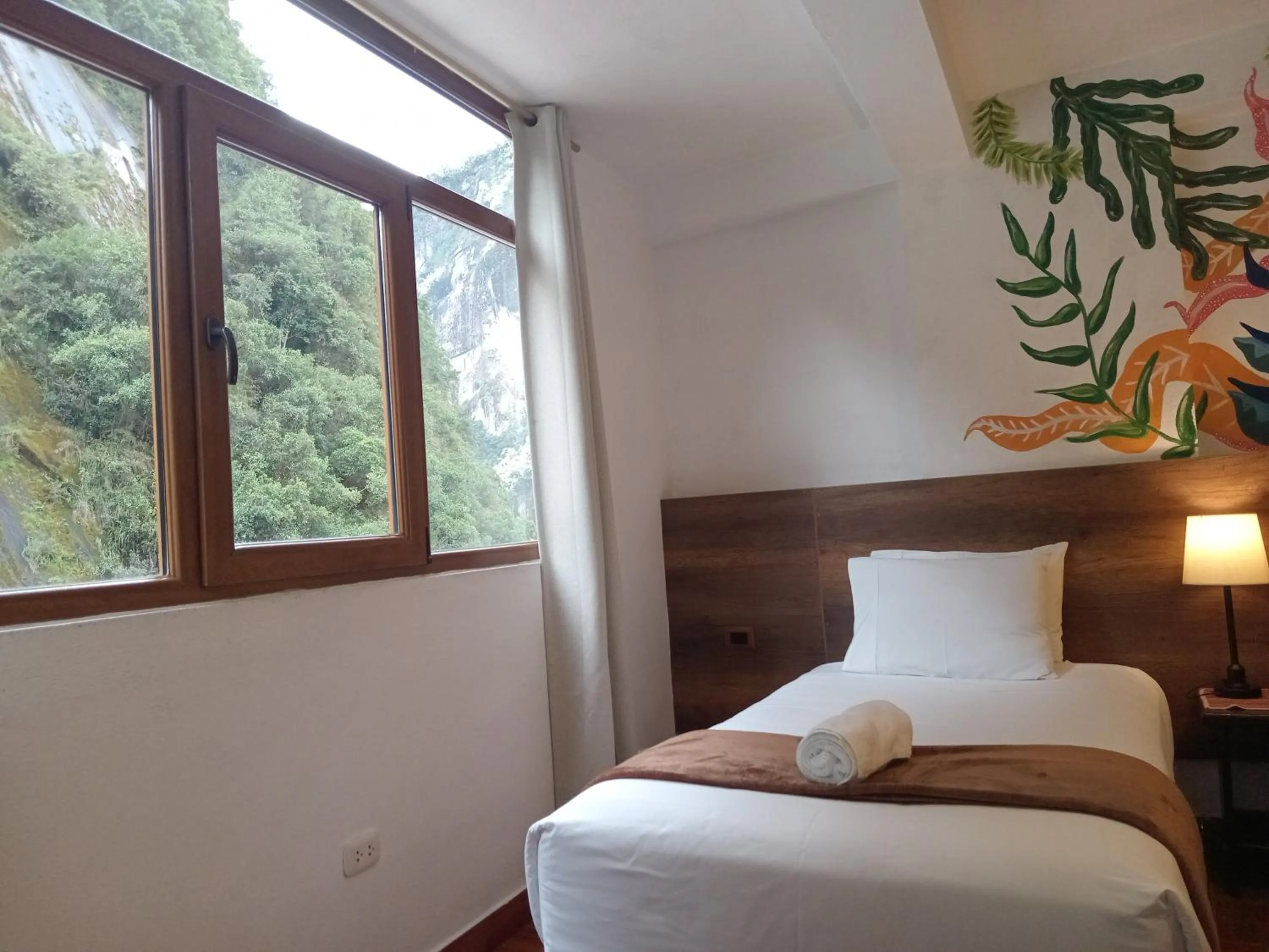 Bed in Susanna Inn MachuPicchu Hotel