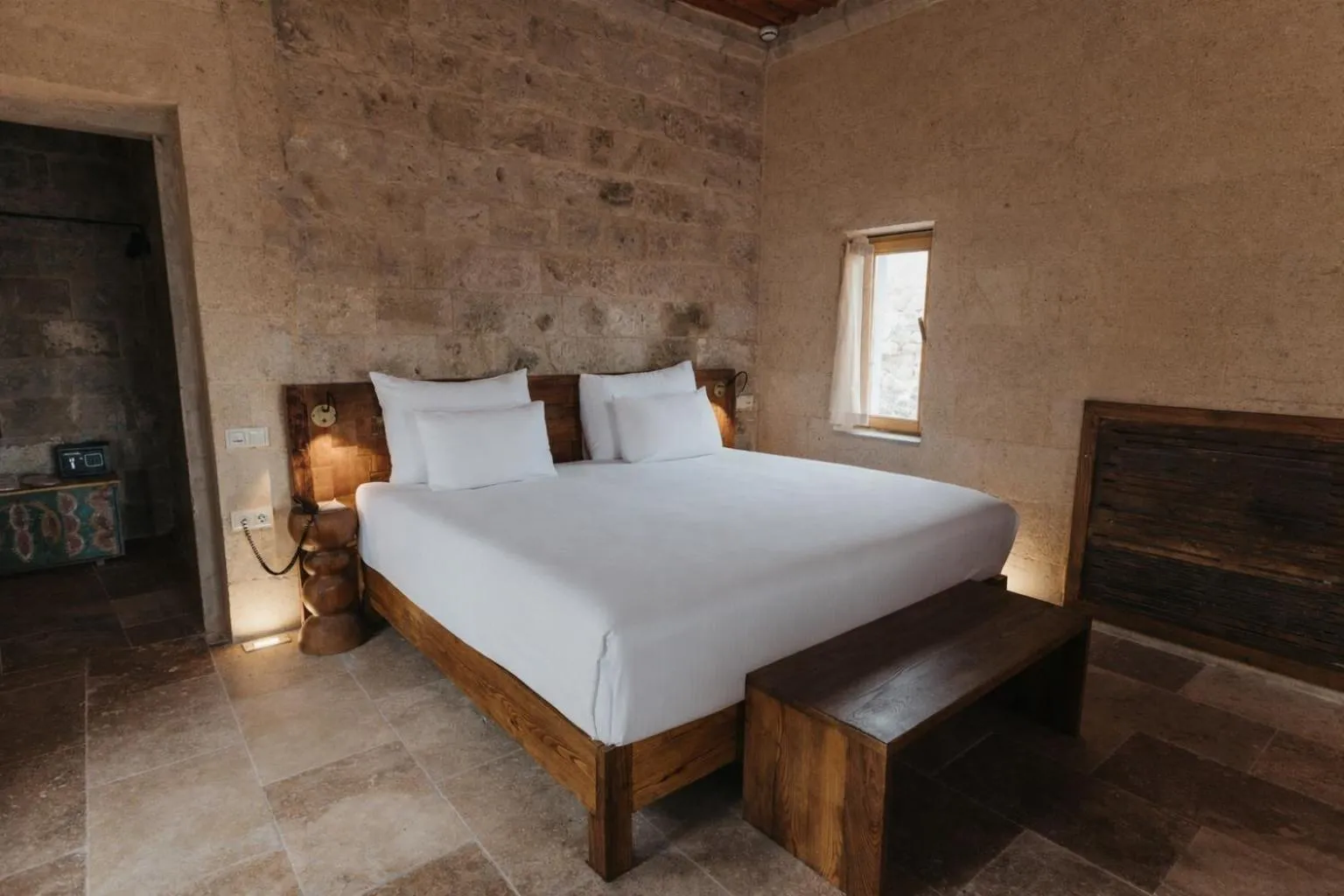 Bed in Millstone Cave Suites Hotel