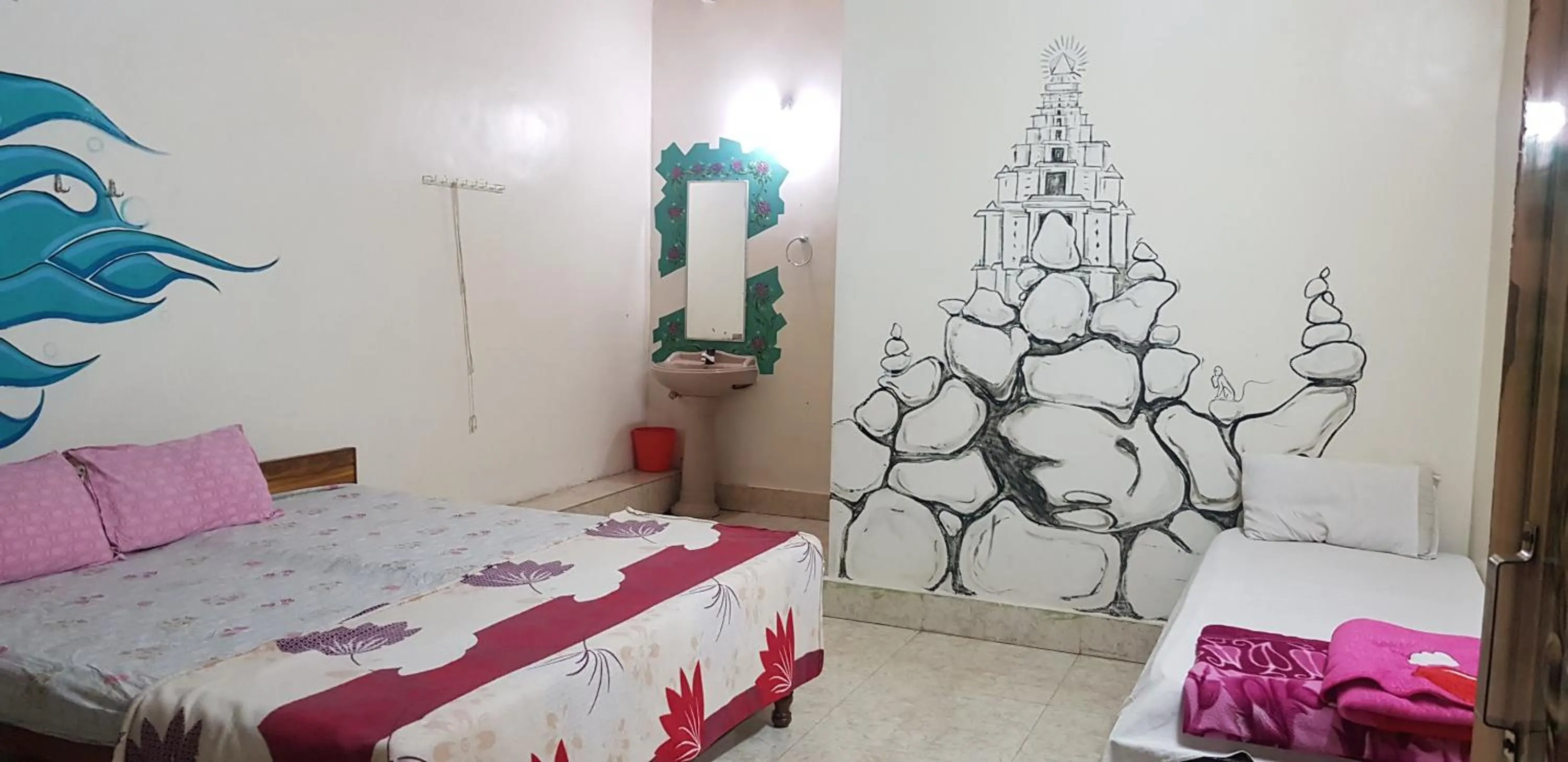 Bed in Padmaa Hampi Villa