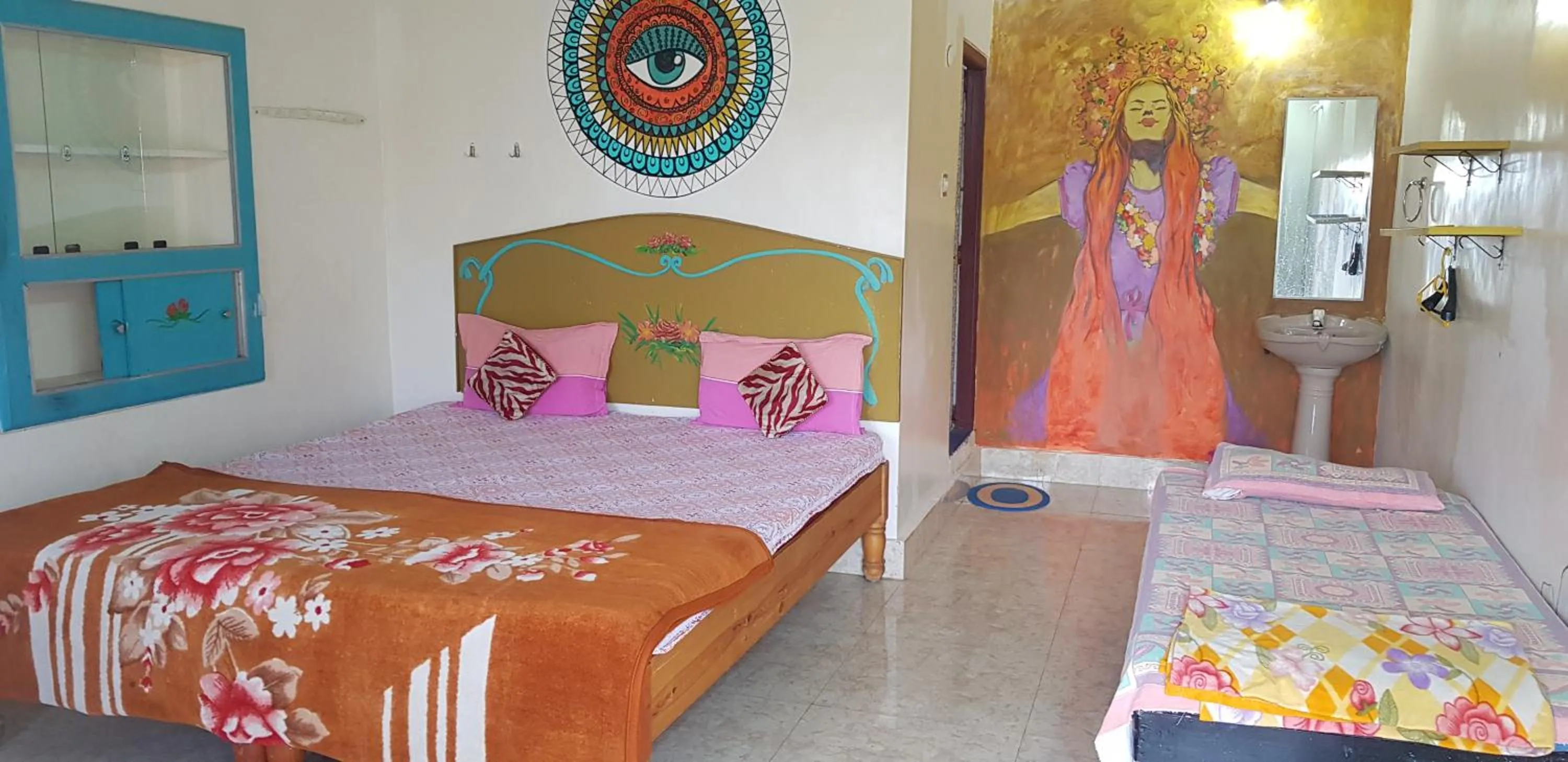 Bed in Padmaa Hampi Villa