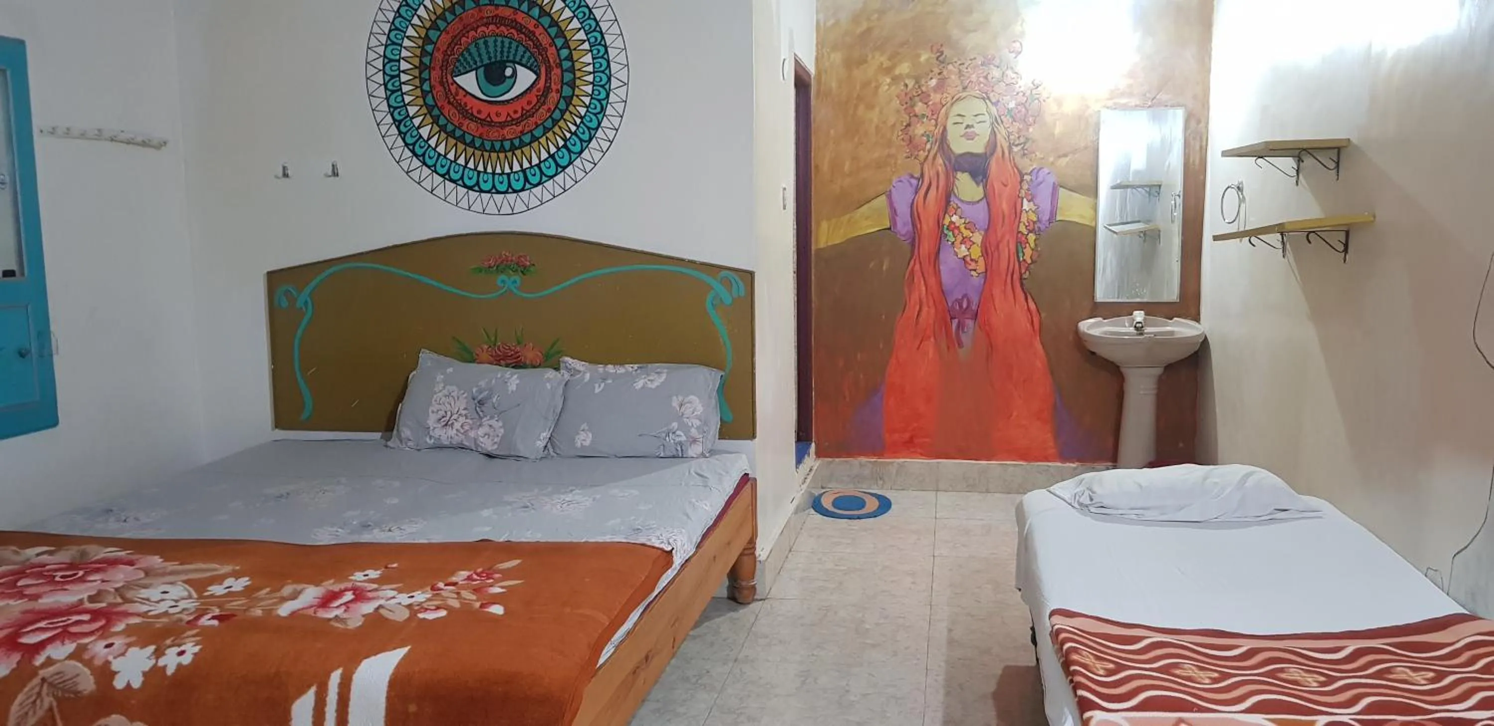Bed in Padmaa Hampi Villa