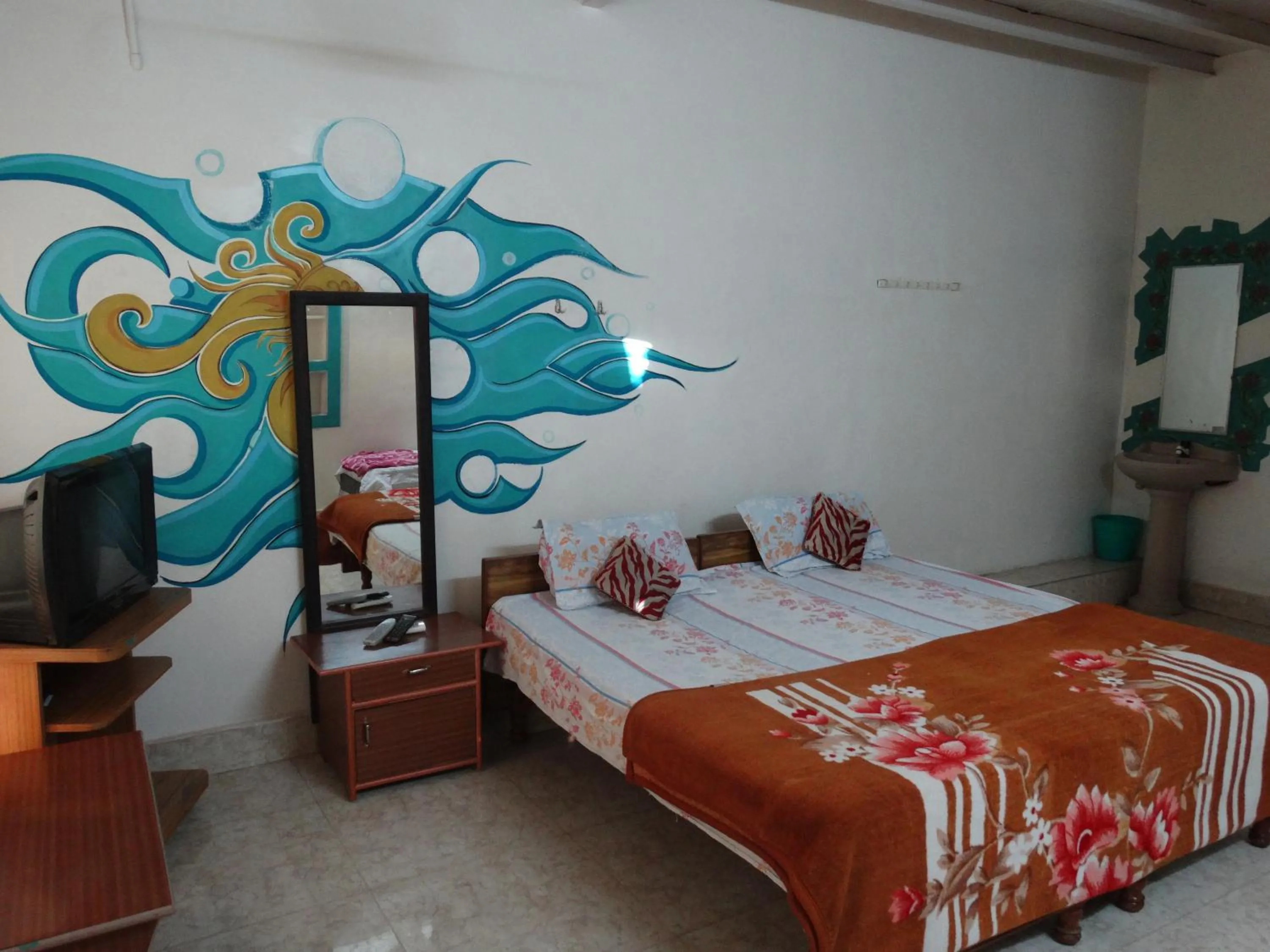 Bed in Padmaa Hampi Villa