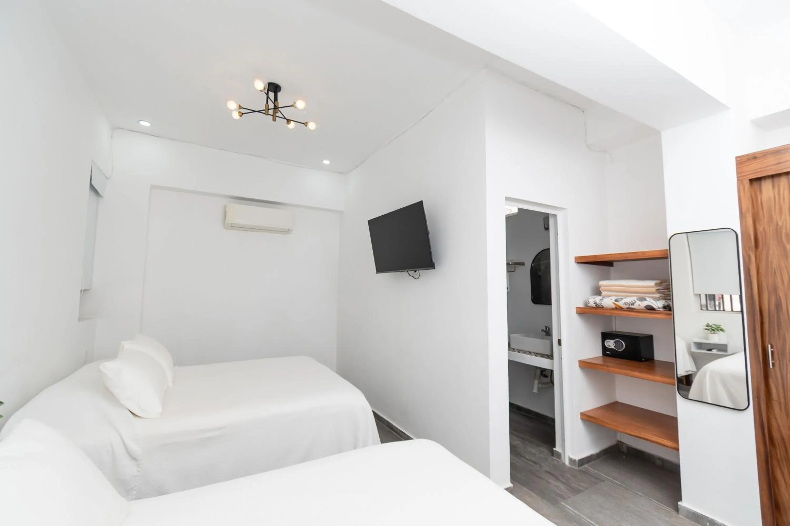 Bed in Safiro Suites Guayabitos Apartments - Adults Only