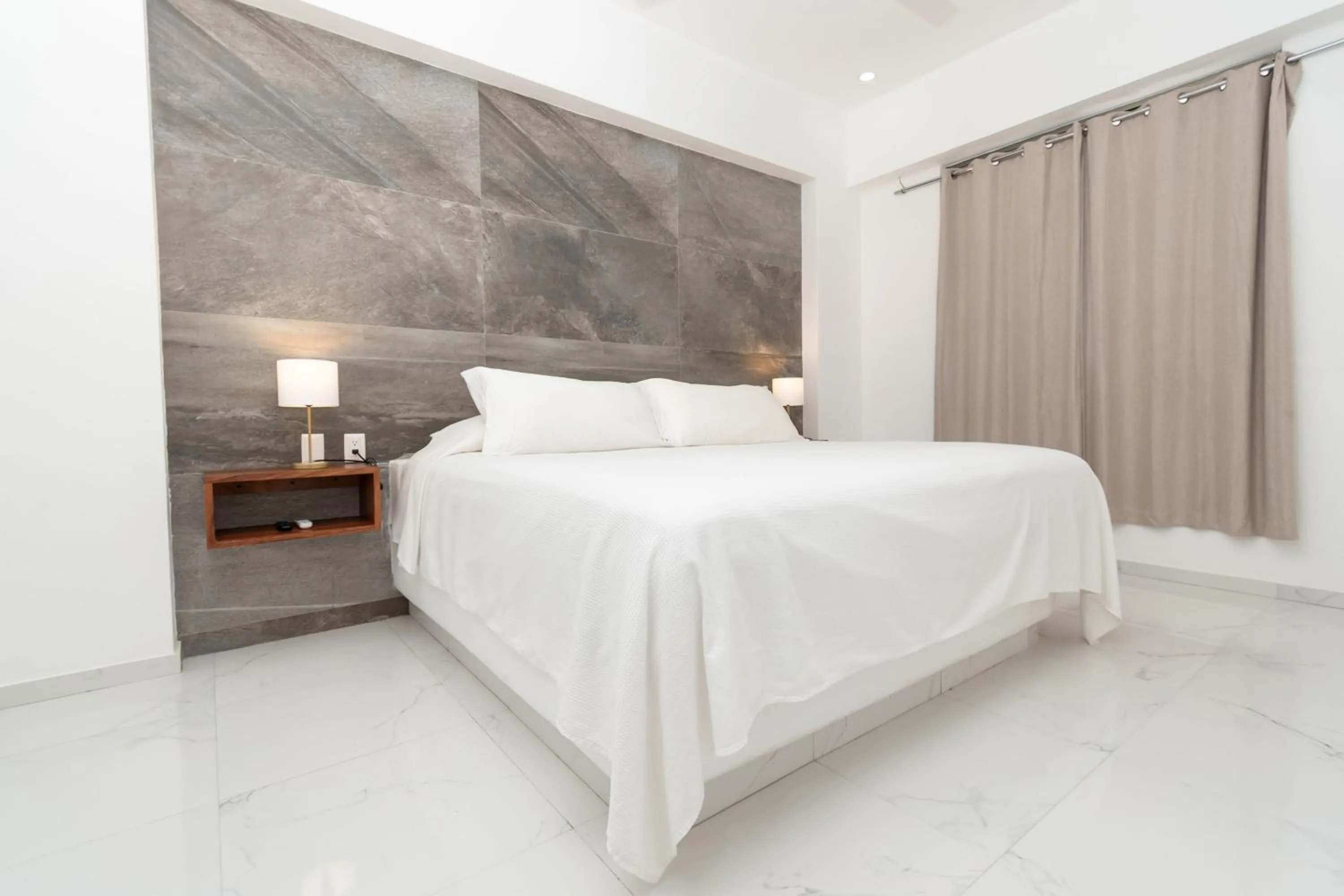 Bed in Safiro Suites Guayabitos Apartments - Adults Only