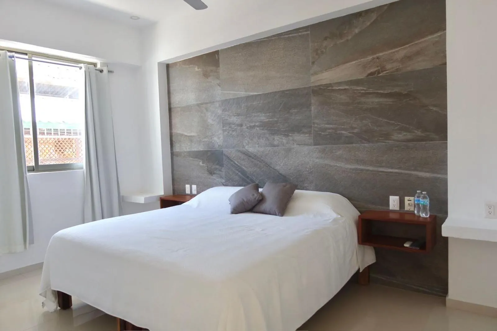 Bedroom, Bed in Safiro Suites Guayabitos Apartments - Adults Only