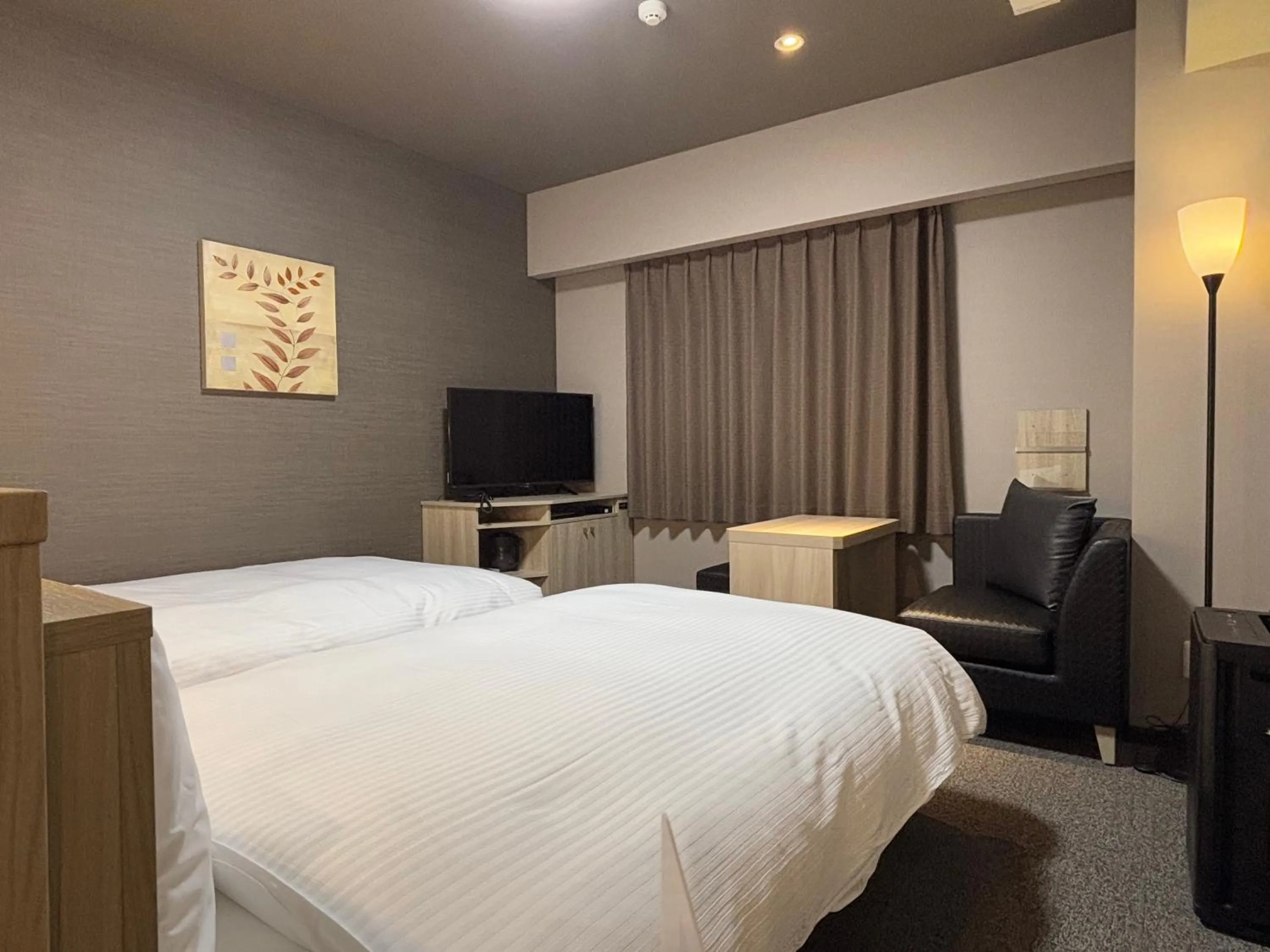 Photo of the whole room, Bed in Hotel Route Inn Okayama Maniwa