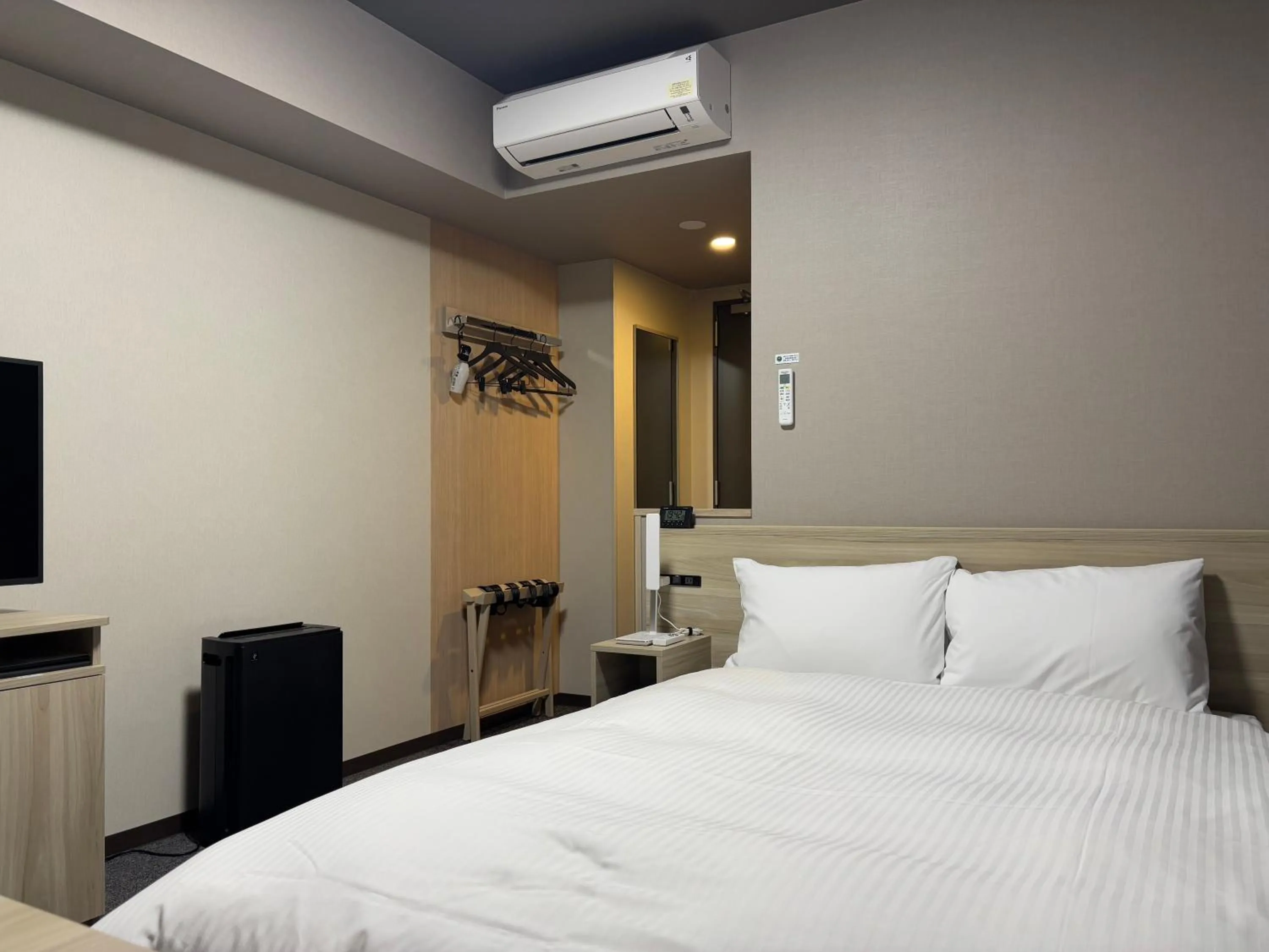 Photo of the whole room, Bed in Hotel Route Inn Okayama Maniwa