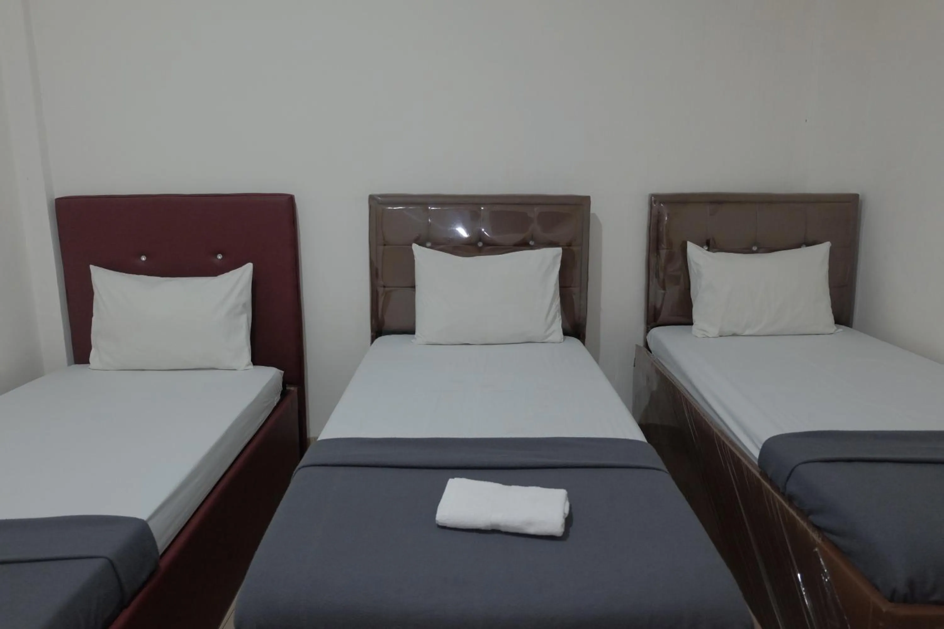 Bed in BI Hotel Kisaran