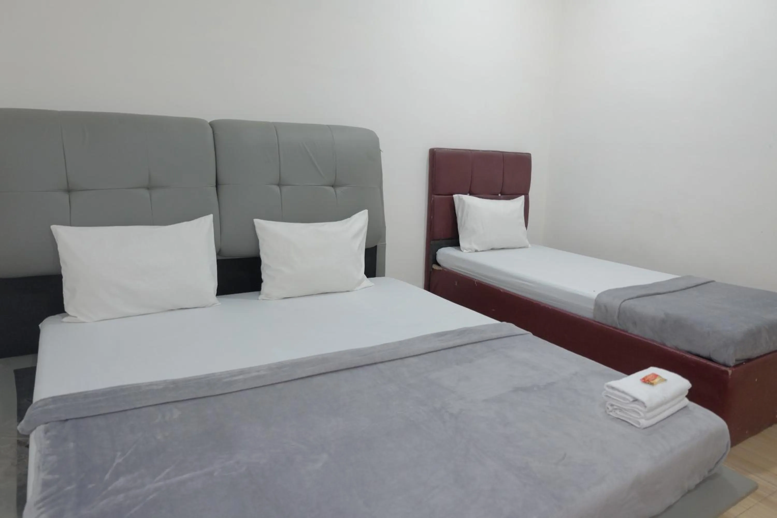 Bed in BI Hotel Kisaran