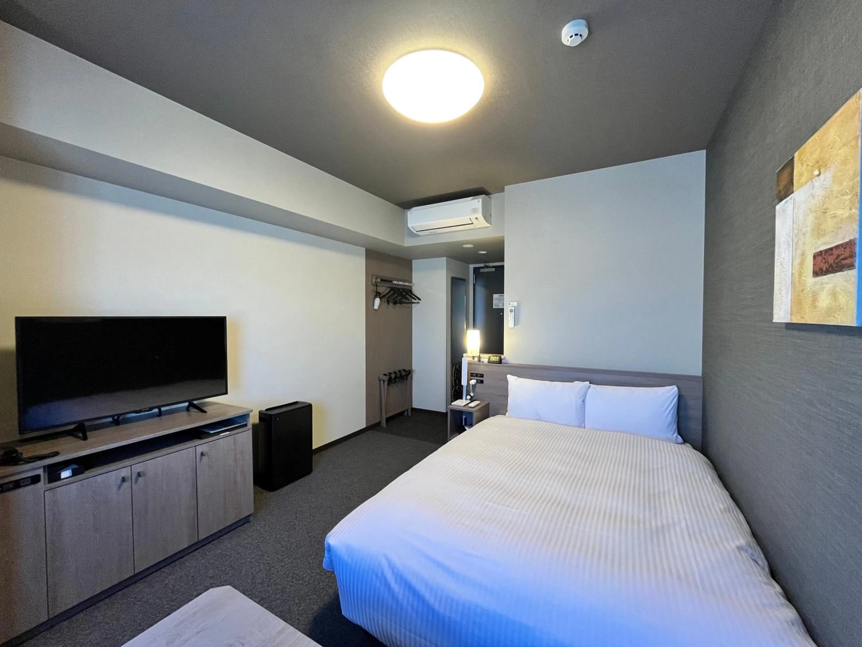 Photo of the whole room, Bed in Hotel Route Inn Grand Fukushima Ekimae Higashiguchi