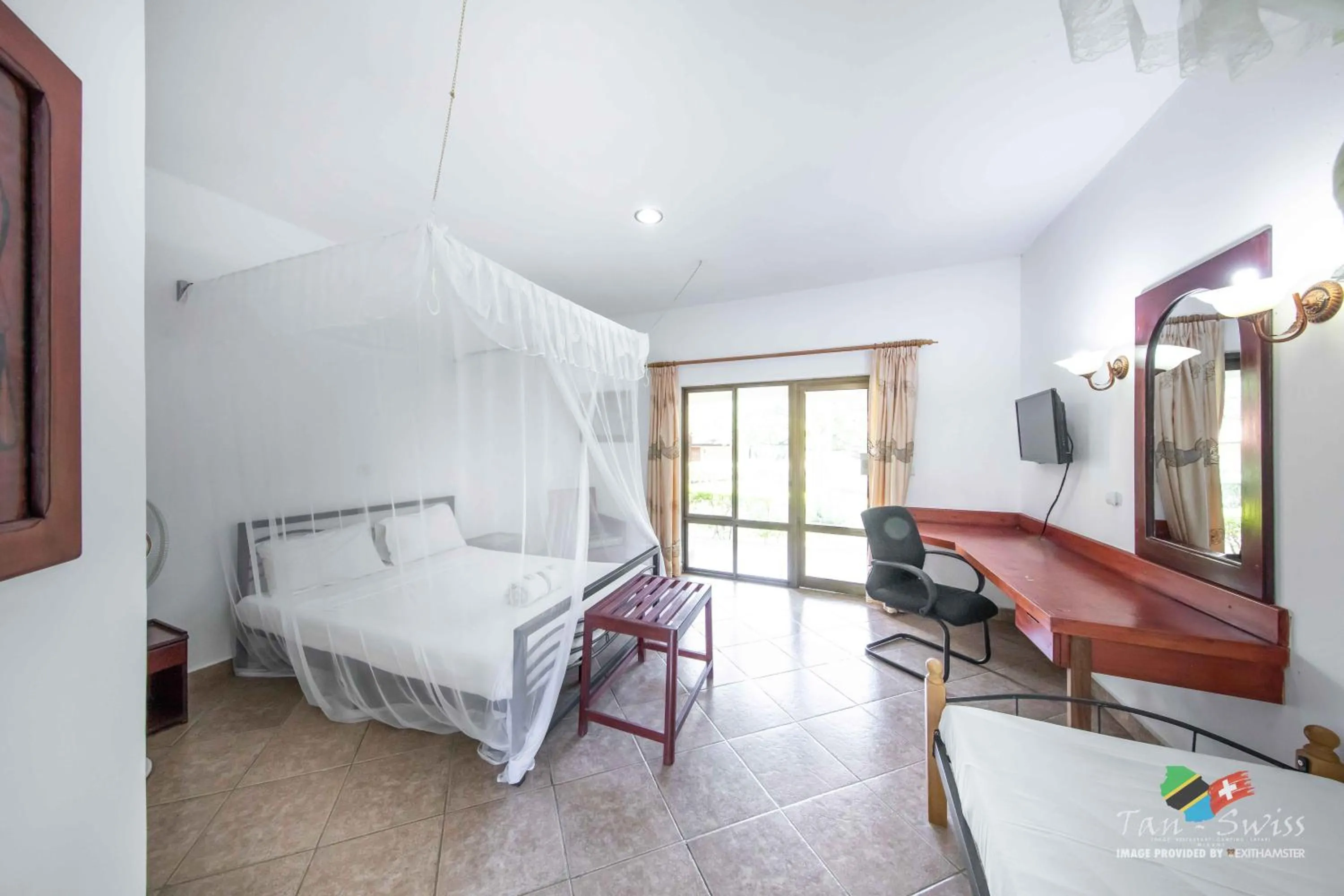 Photo of the whole room, Bed in Tan-Swiss Lodge