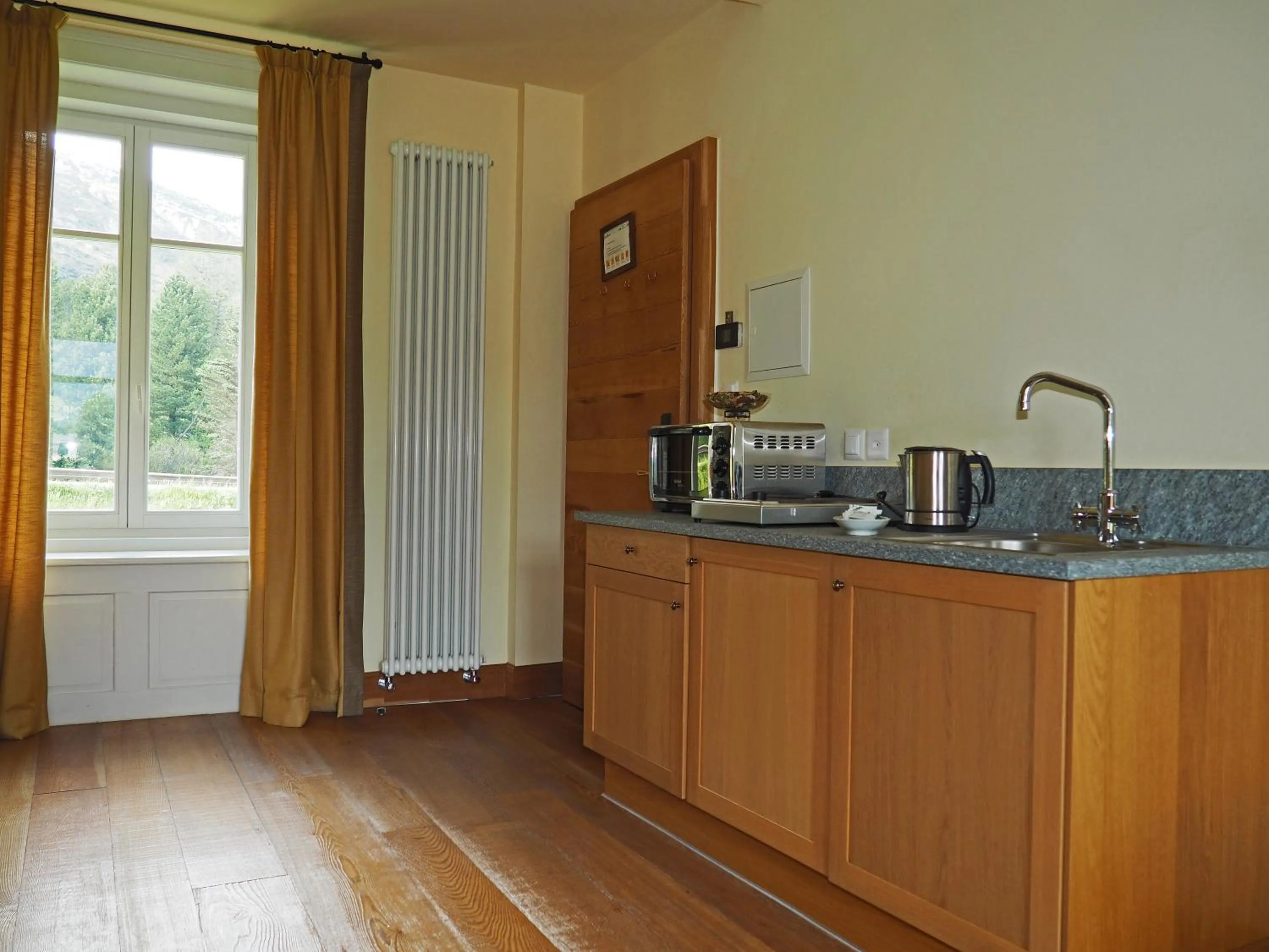 Kitchen or kitchenette in Maloja Palace Residence Engadin-St Moritz CO2-Neutral