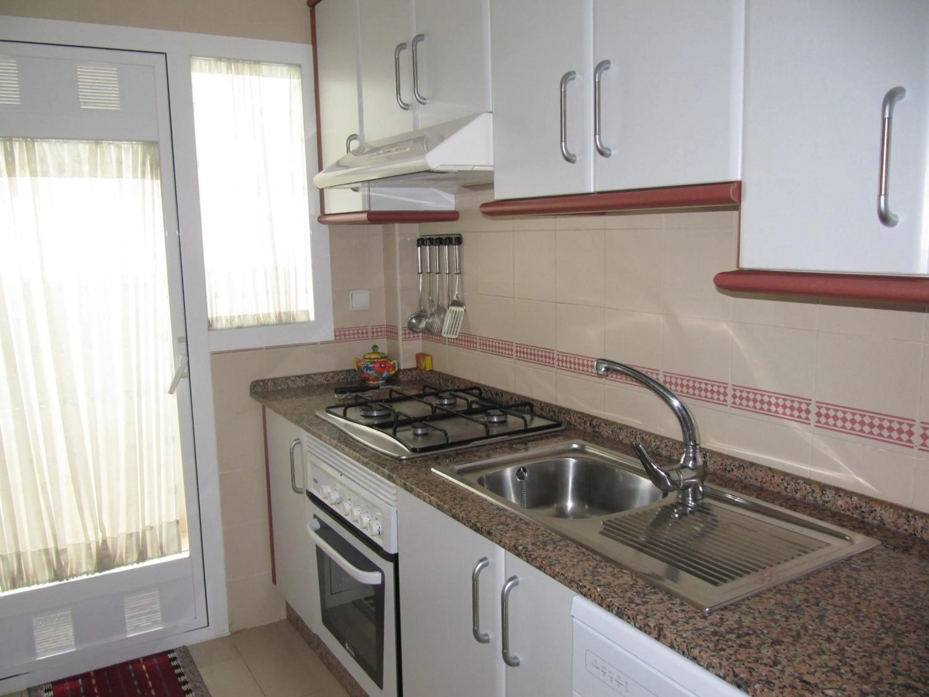 Kitchen or kitchenette in Life Apartments Costa Ballena