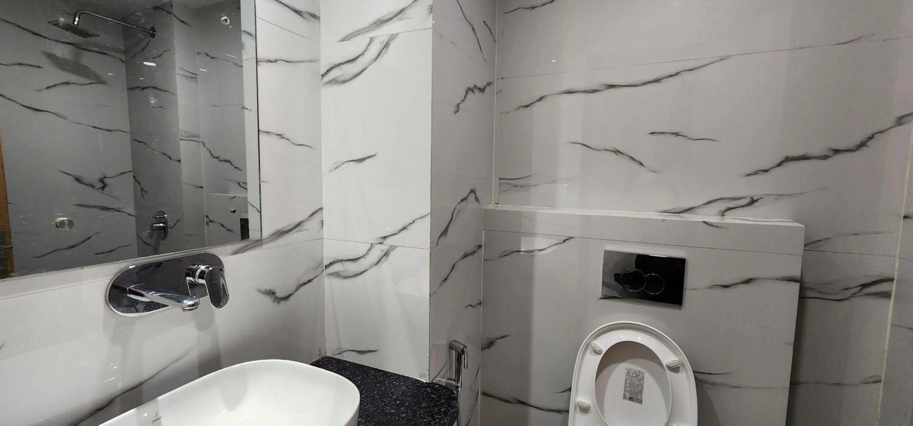 Bathroom in Hotel Shree Sai Dham