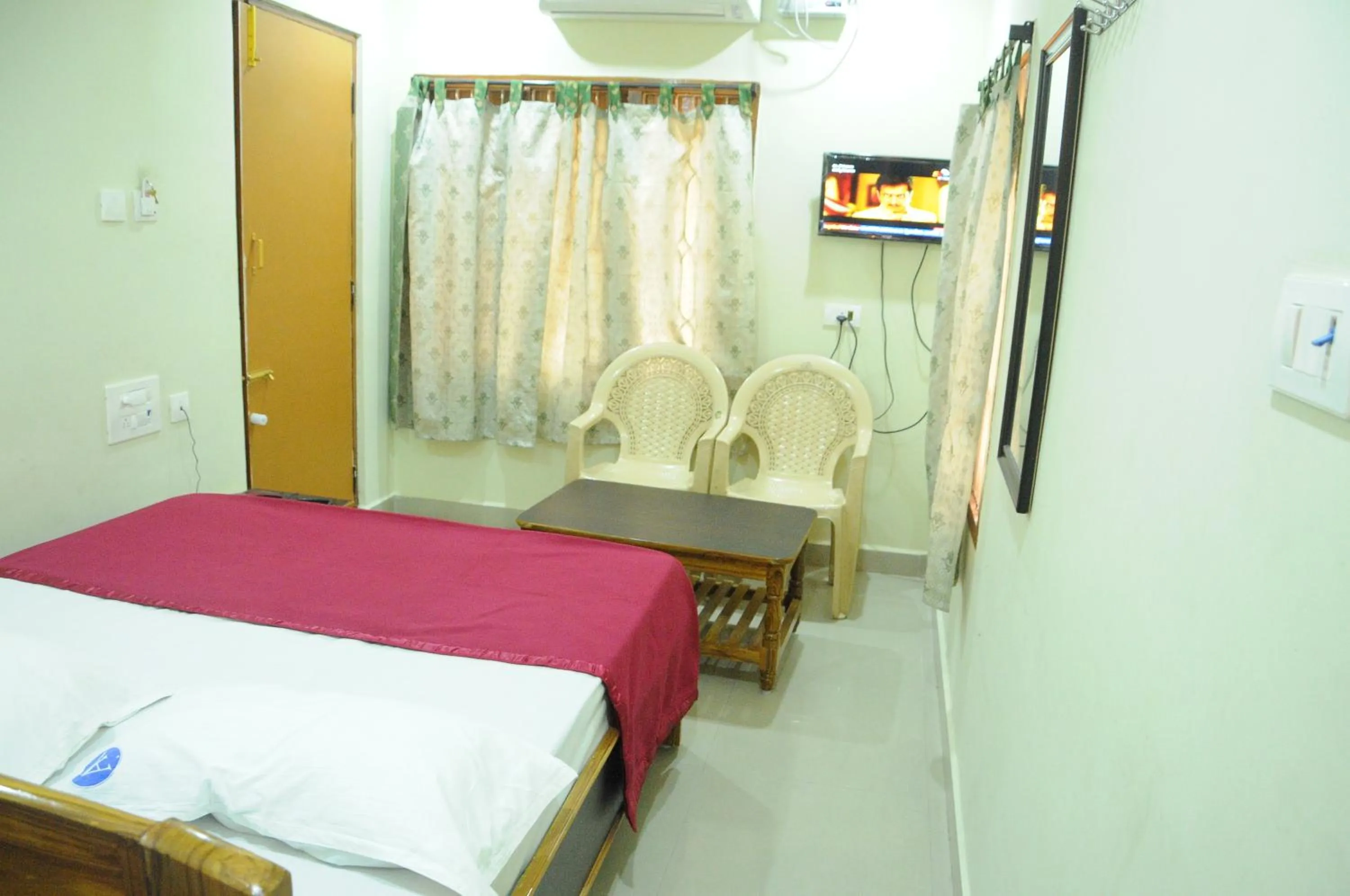Photo of the whole room, Bed in Hotel Agarala Residency