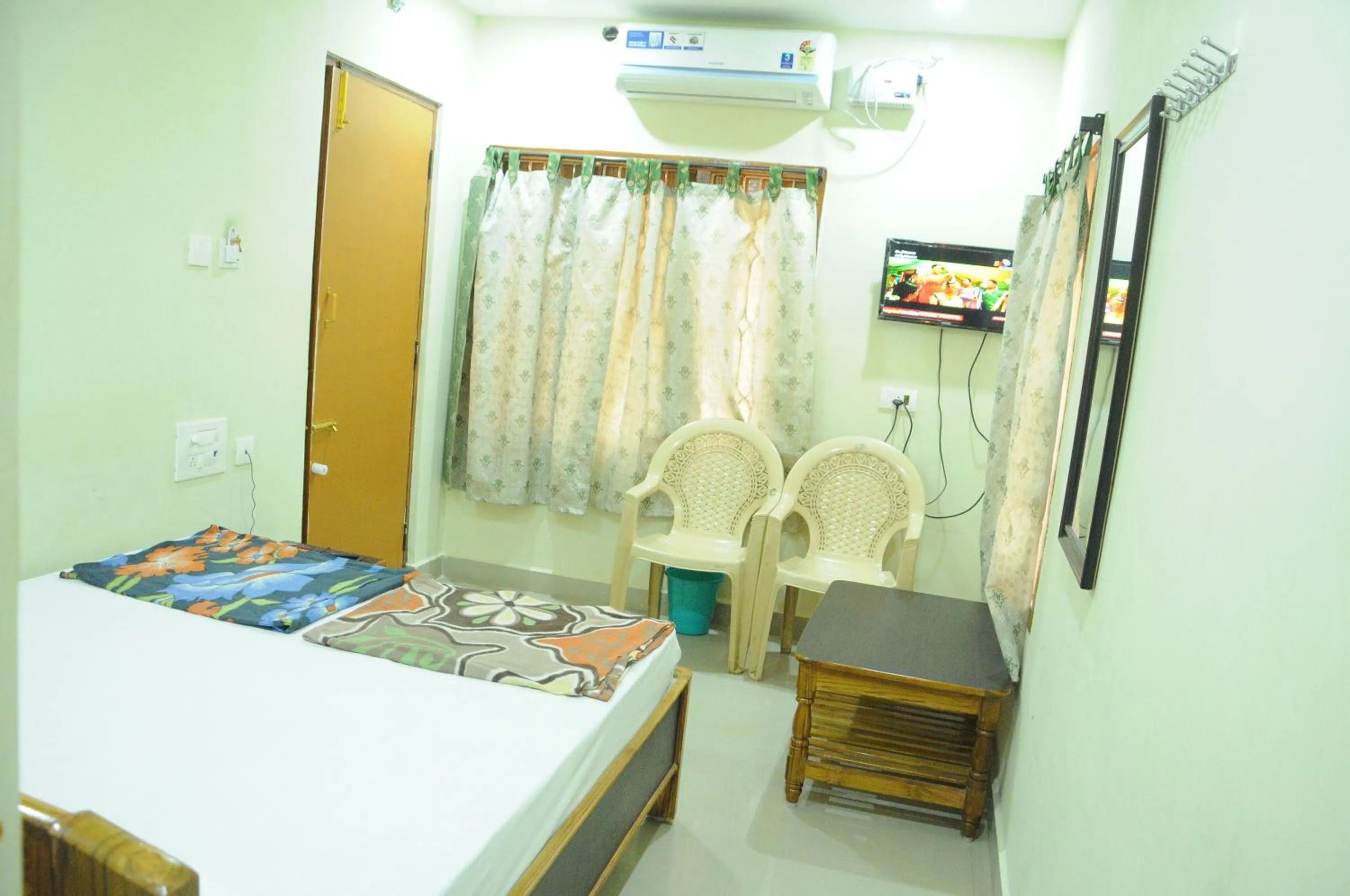 Photo of the whole room, Bed in Hotel Agarala Residency