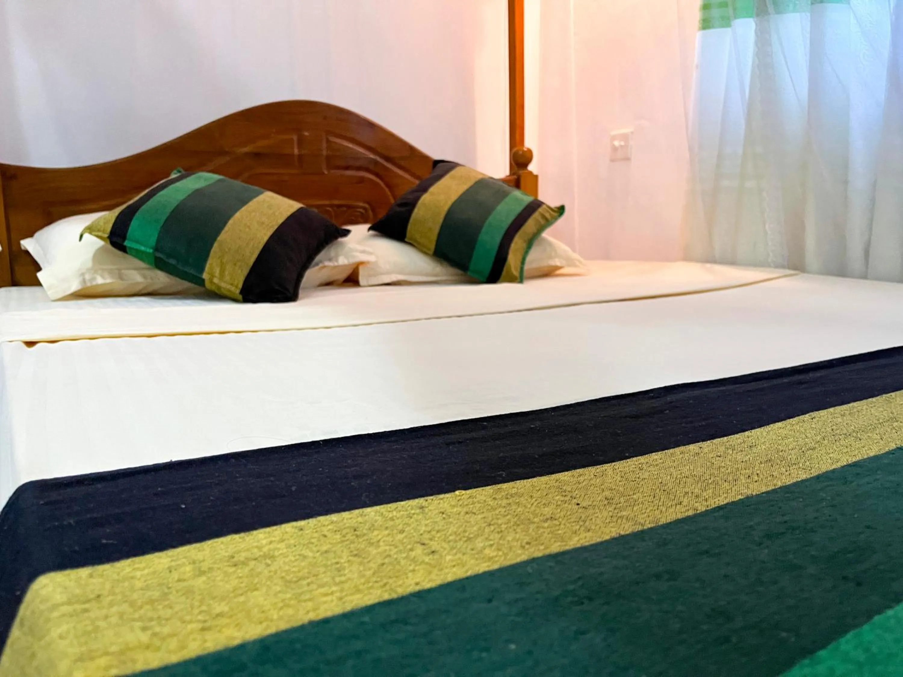 Bed in Damith Tourist Inn