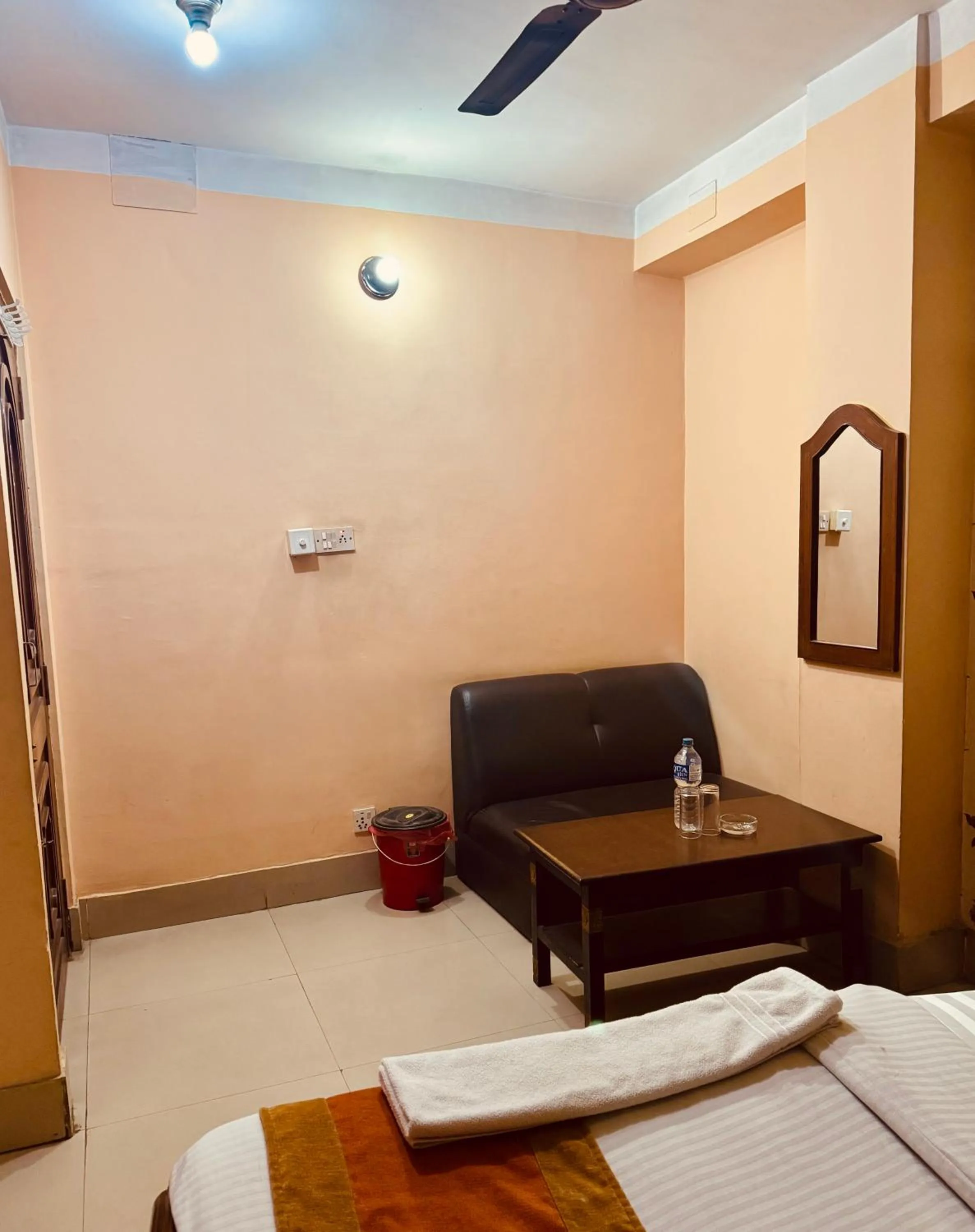 Living room, Bed in Om Mandakini Hotel