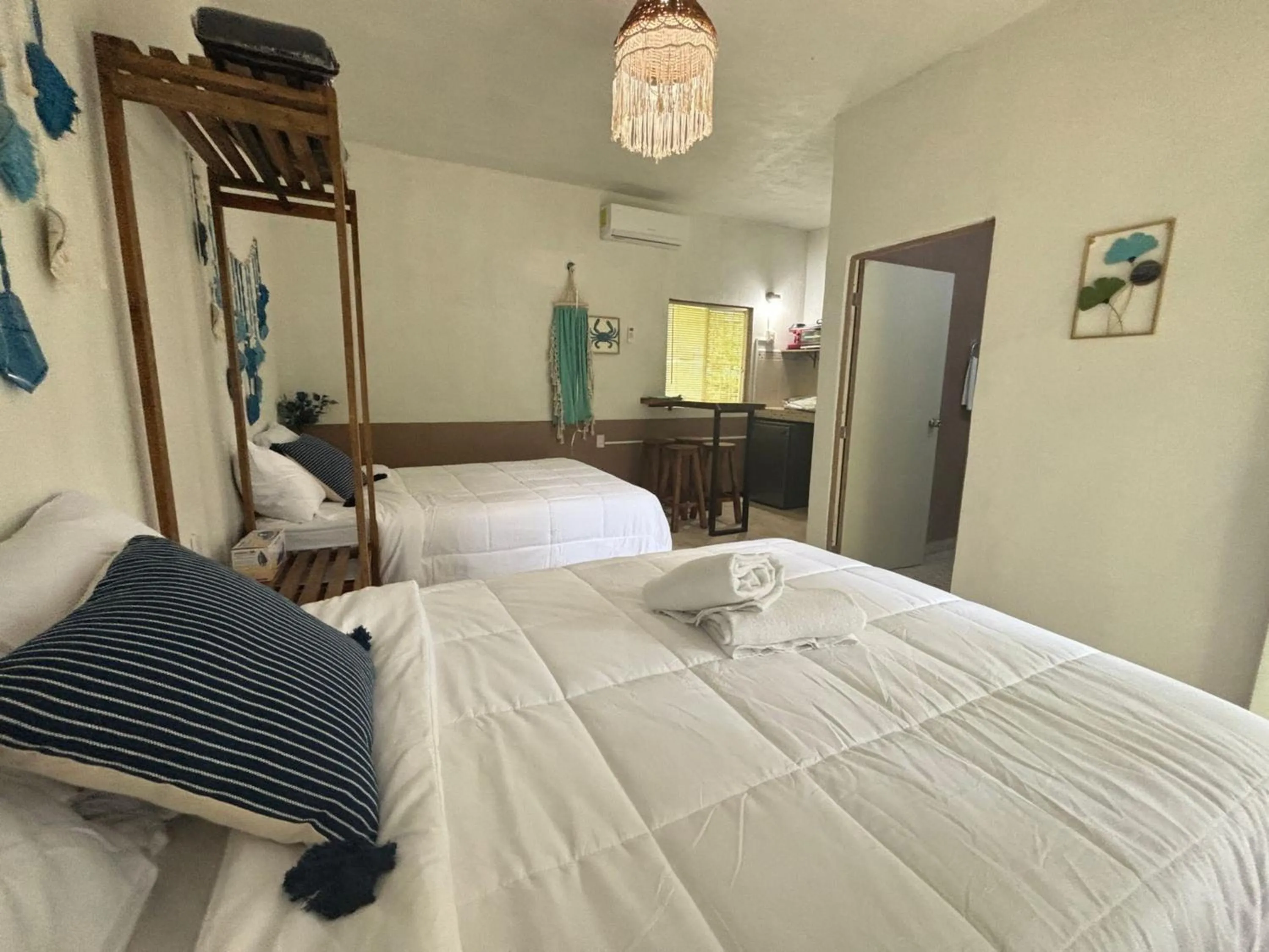 Bed in BACALAR INN Hotel
