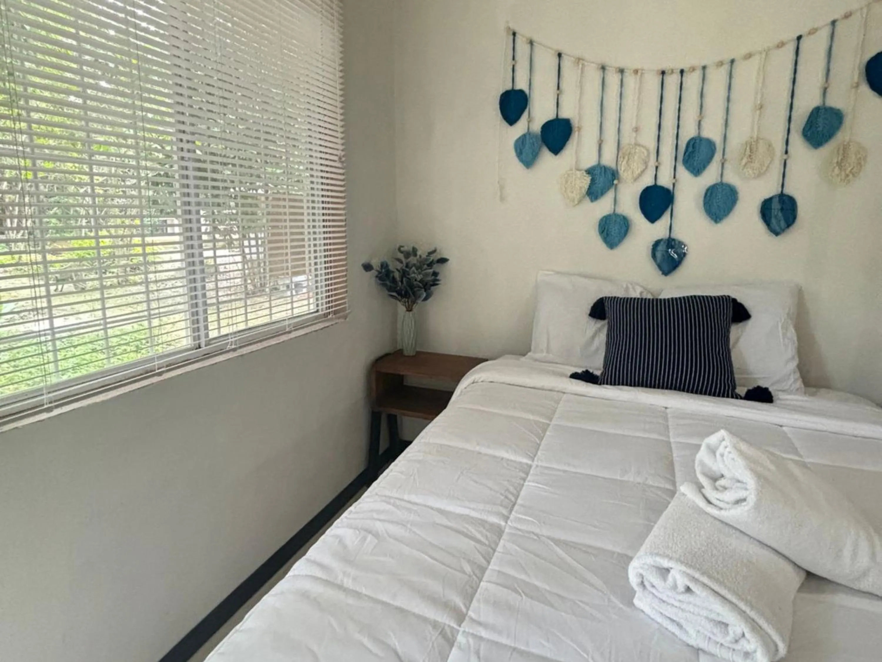 Bed in BACALAR INN Hotel