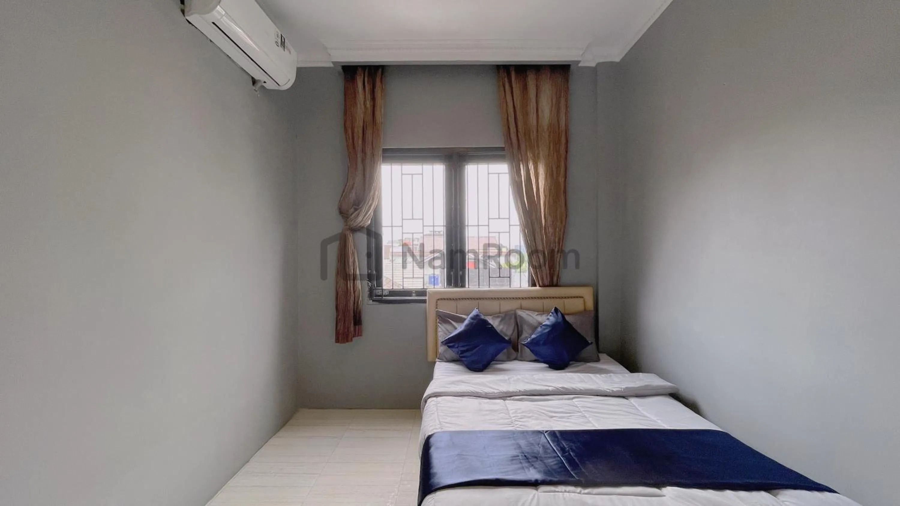 Bed in NamRoom at Kebayoran Baru