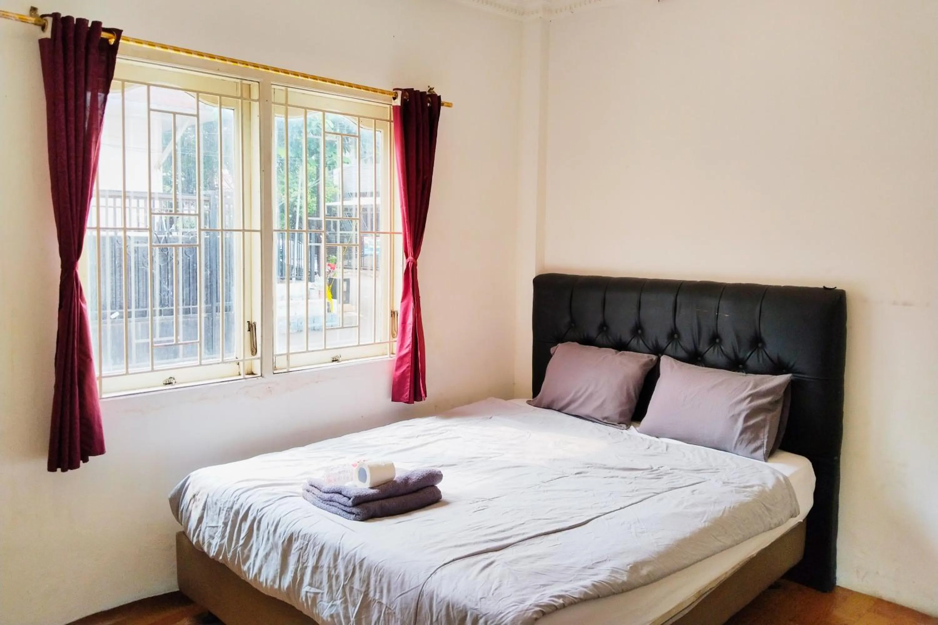 Bed in NamRoom at Kebayoran Baru