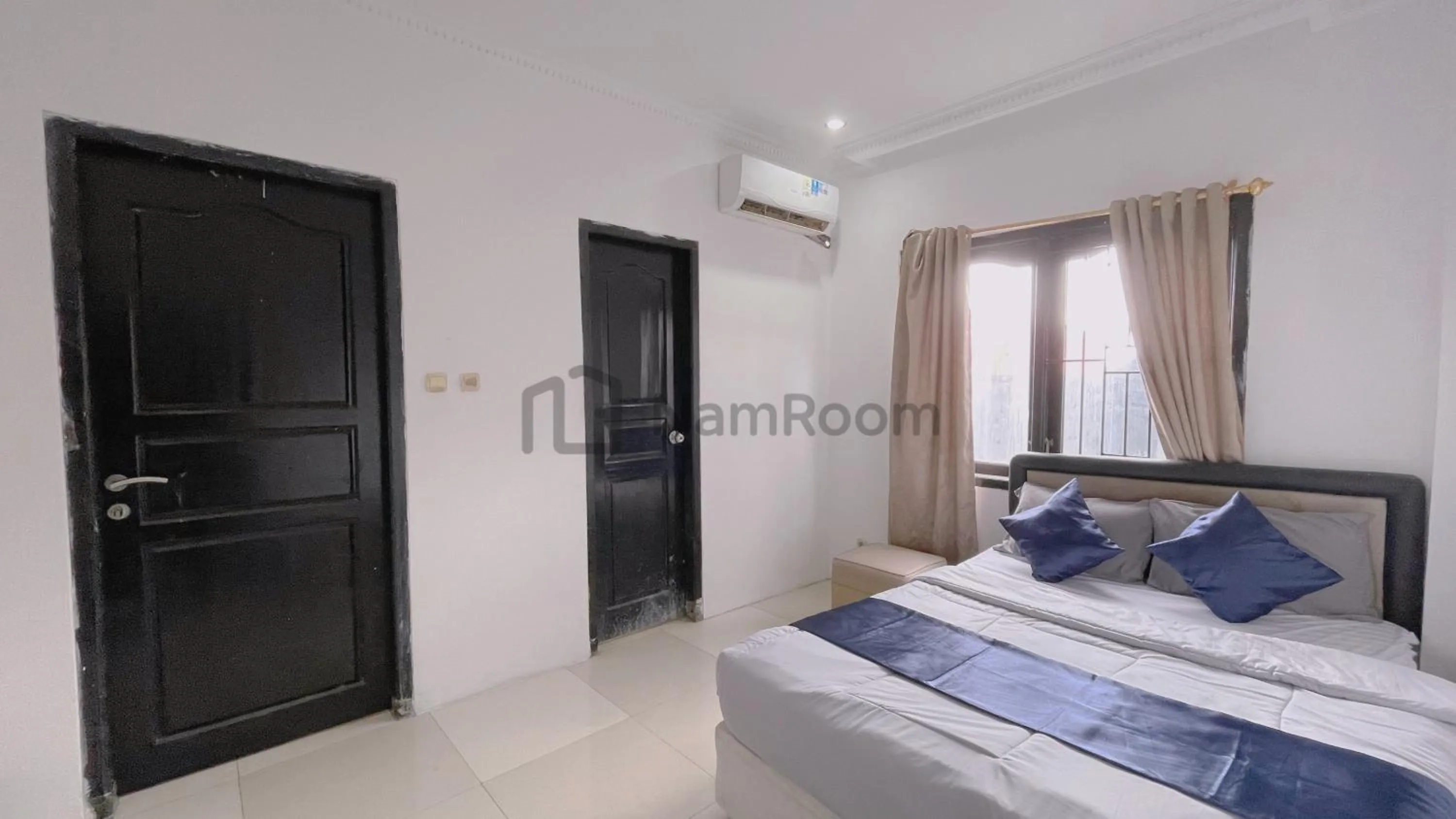 Bed in NamRoom at Kebayoran Baru