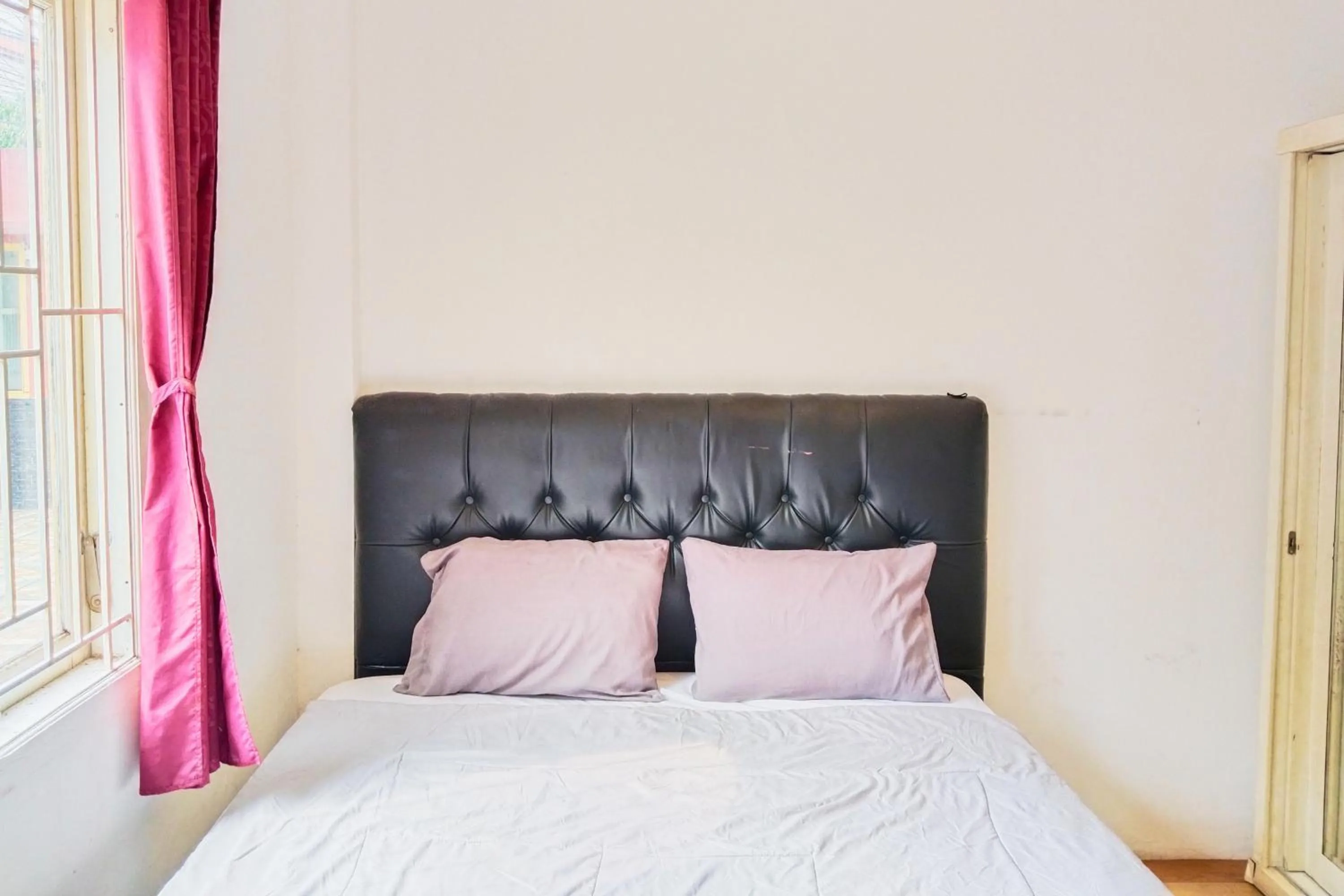 Bed in NamRoom at Kebayoran Baru