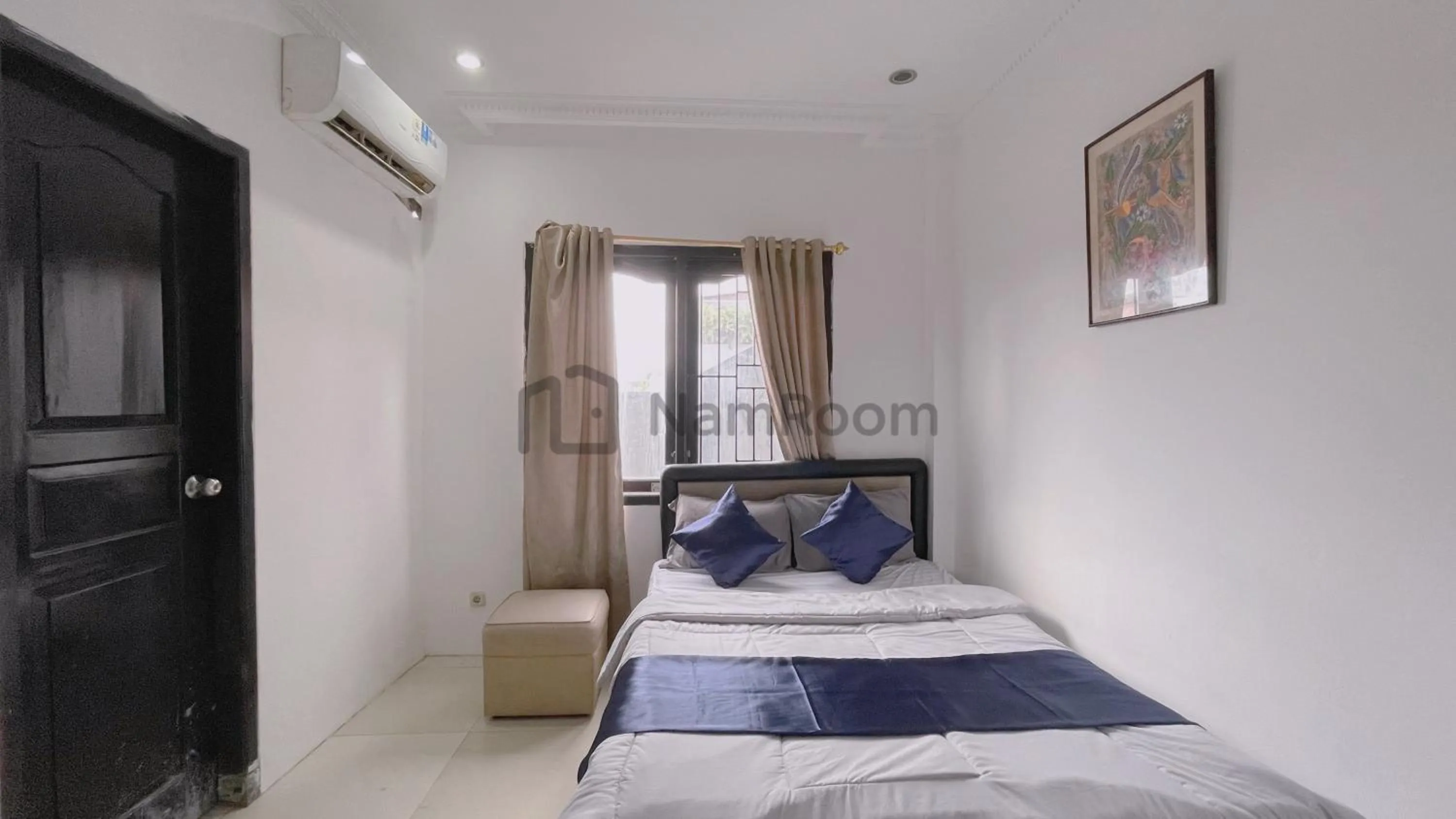 Bed in NamRoom at Kebayoran Baru