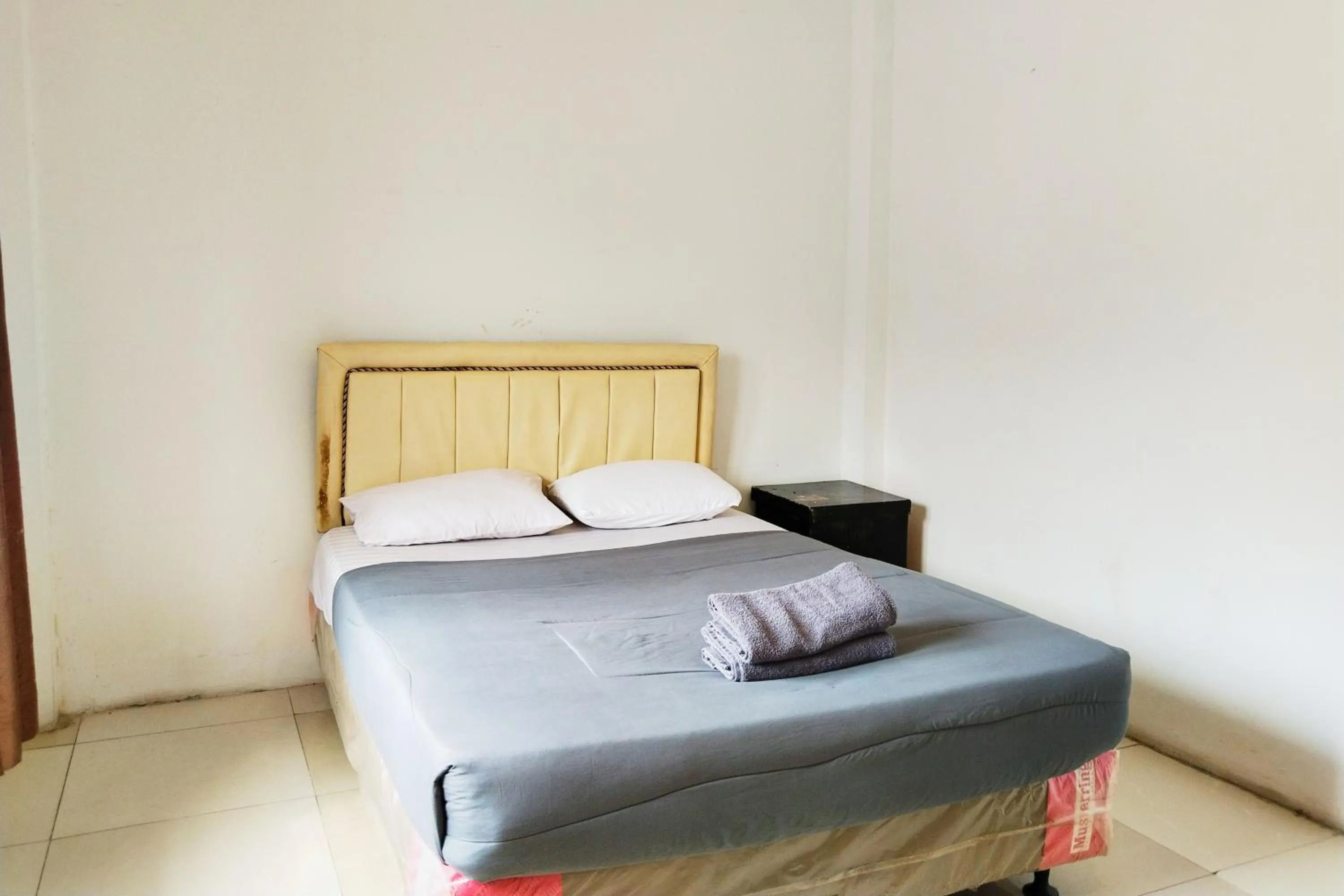 Bed in NamRoom at Kebayoran Baru
