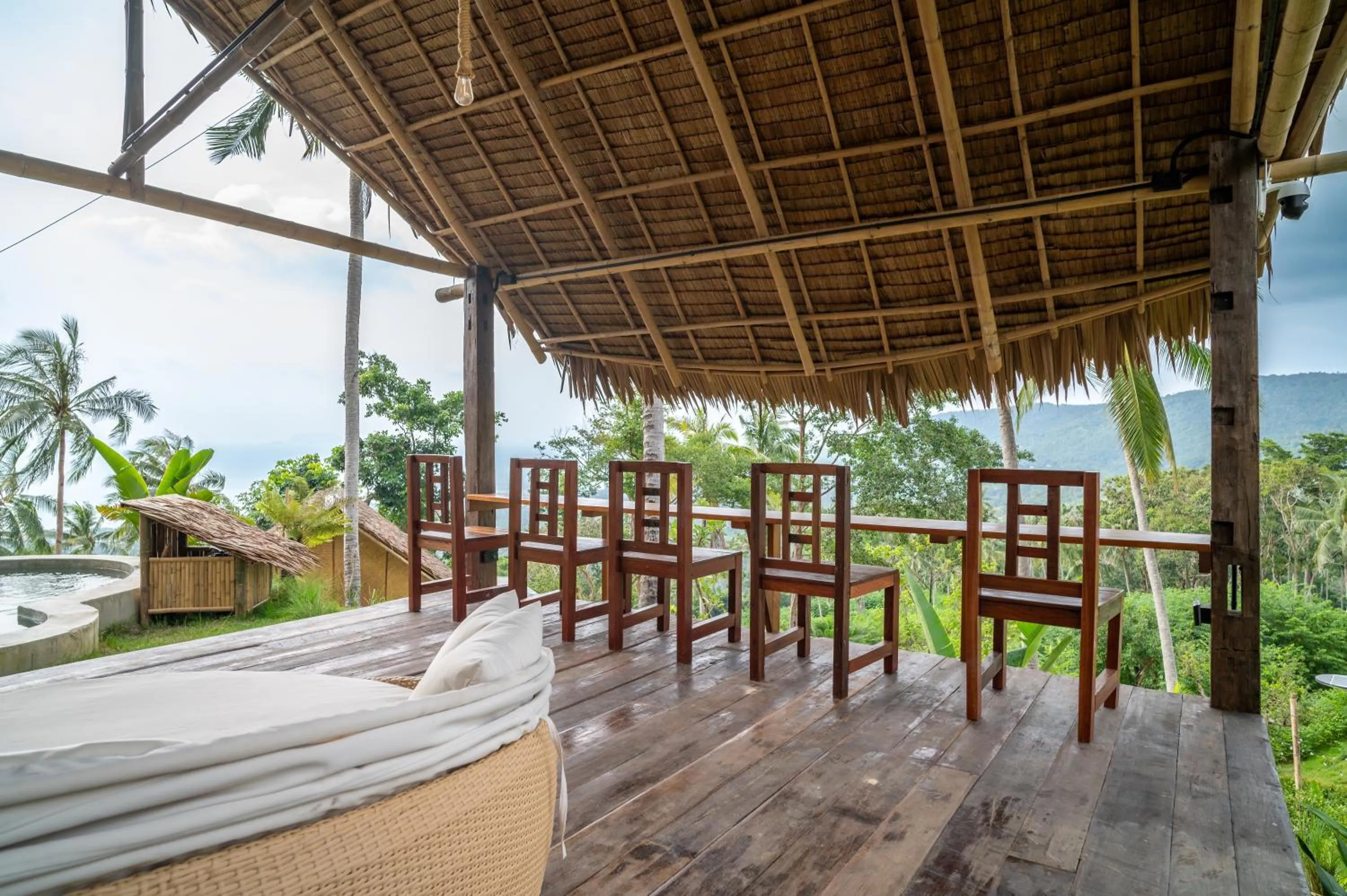 Communal lounge/ TV room in RoomQuest THEVA Resort Koh Samui