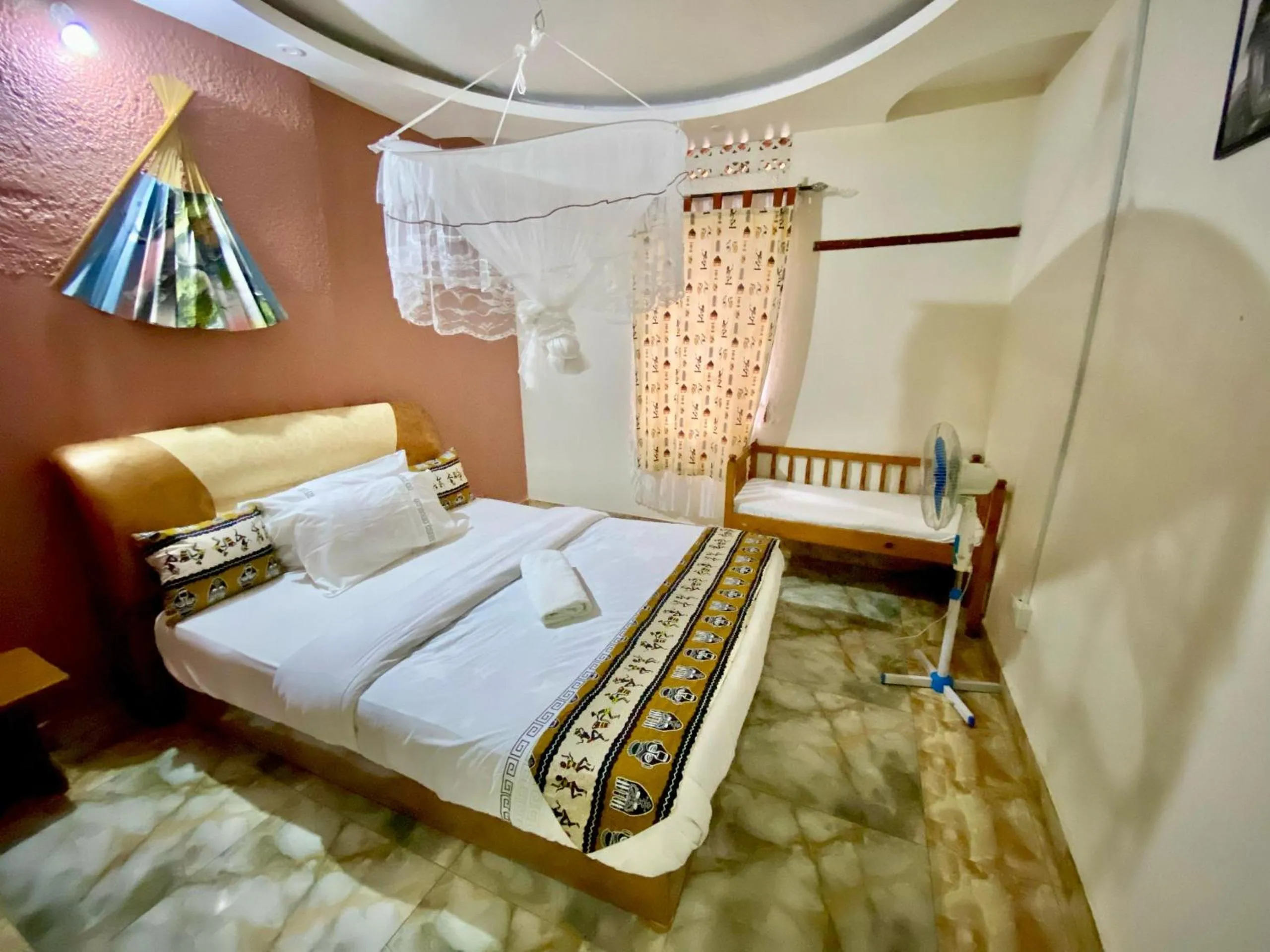 Bed in Gorilla African Guest House