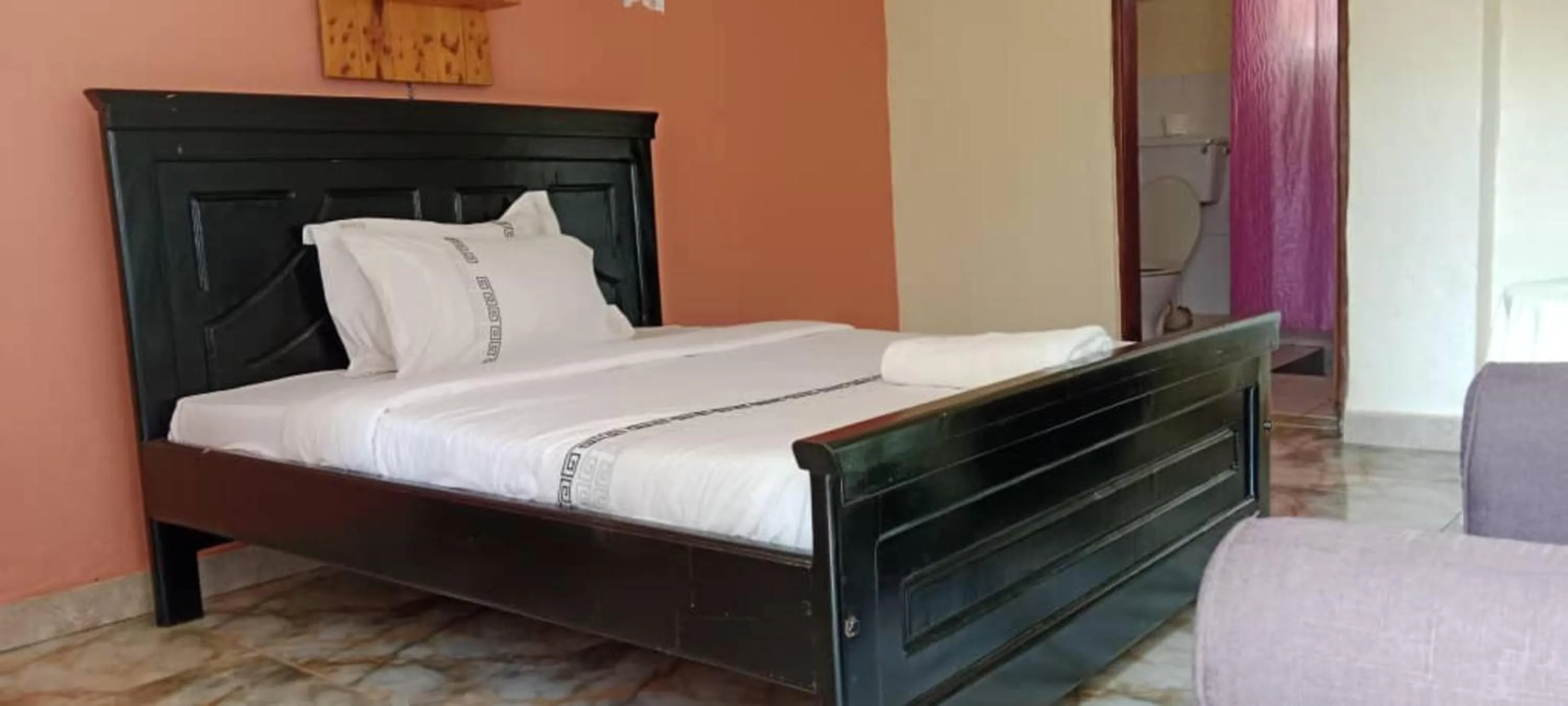 Bed in Gorilla African Guest House