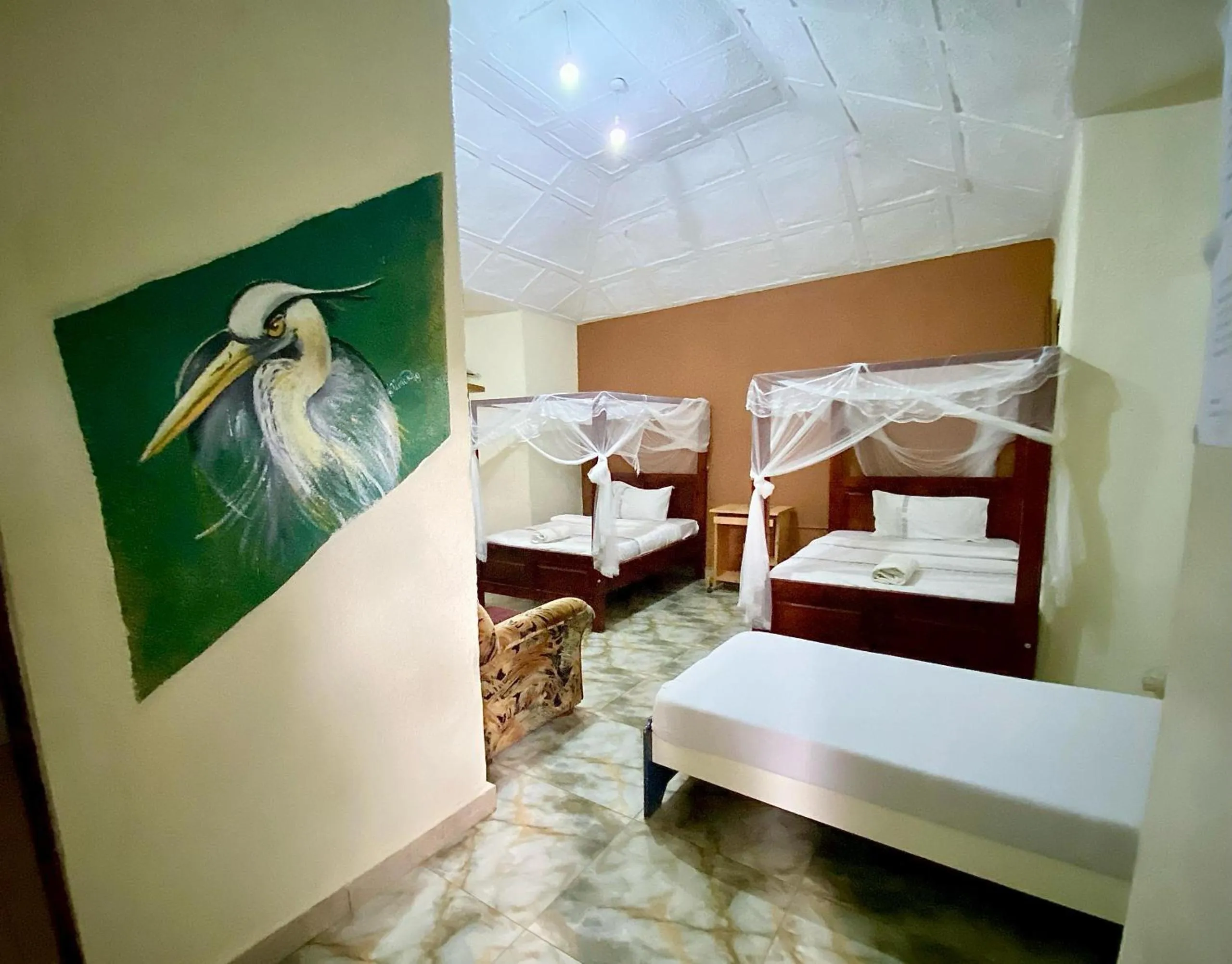 Bed in Gorilla African Guest House