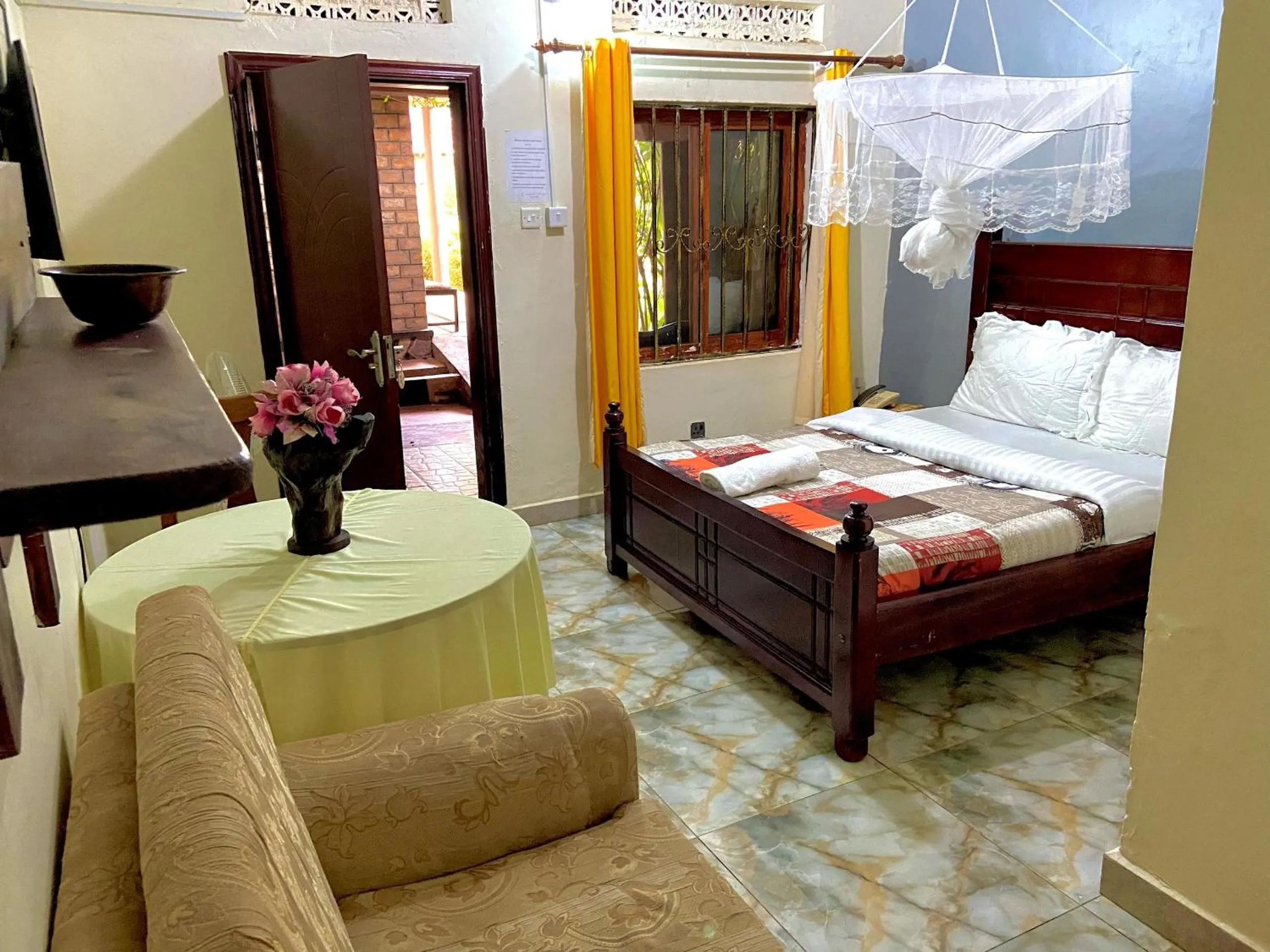 Bed in Gorilla African Guest House