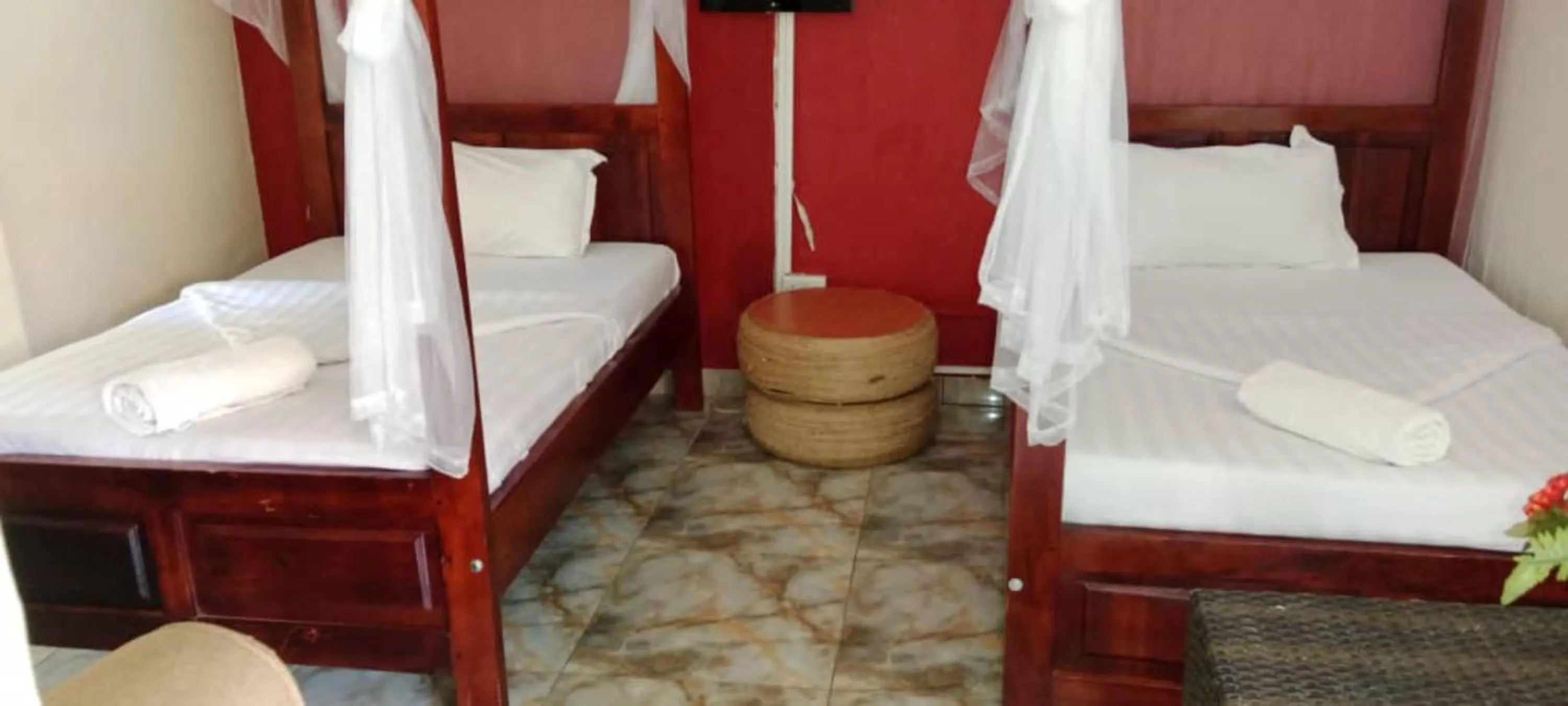 Bed in Gorilla African Guest House