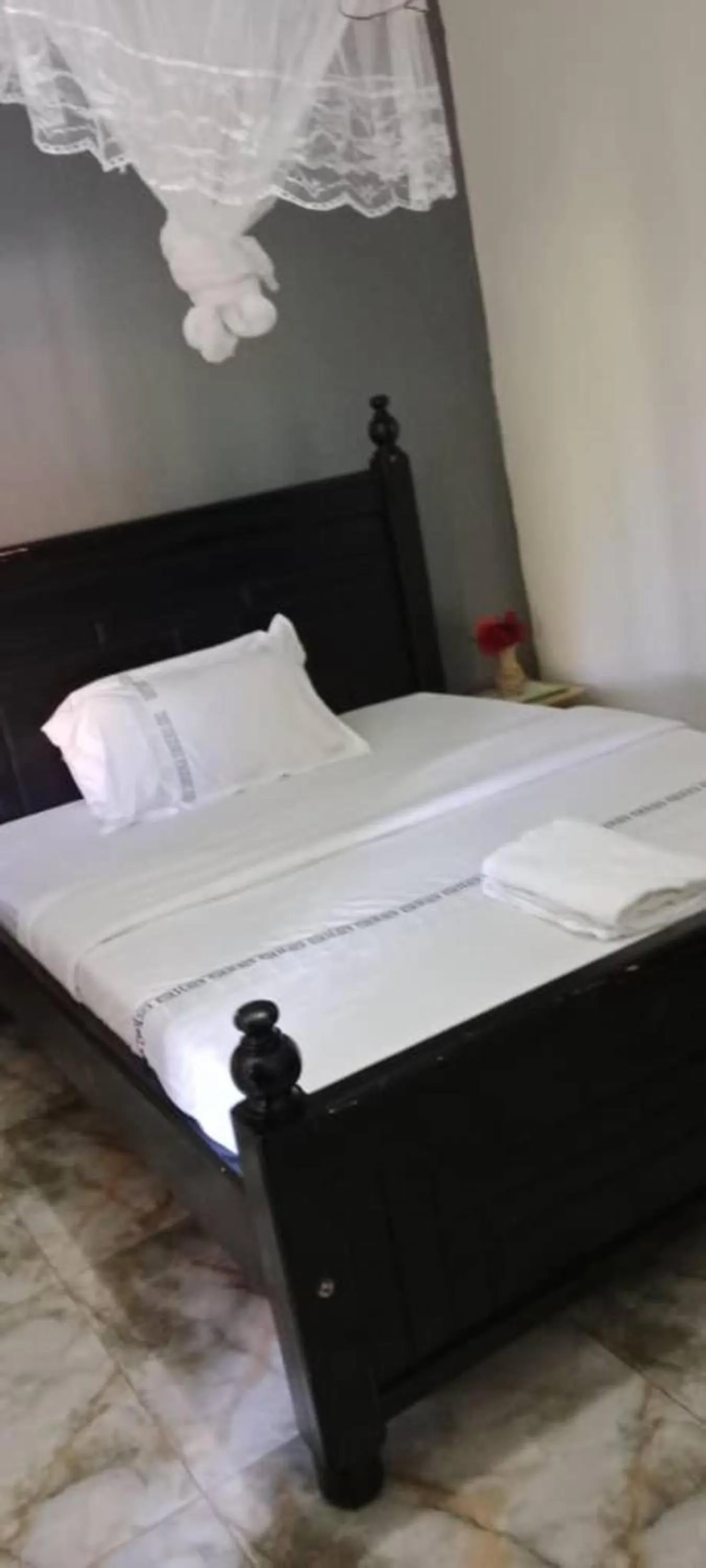 Bed in Gorilla African Guest House