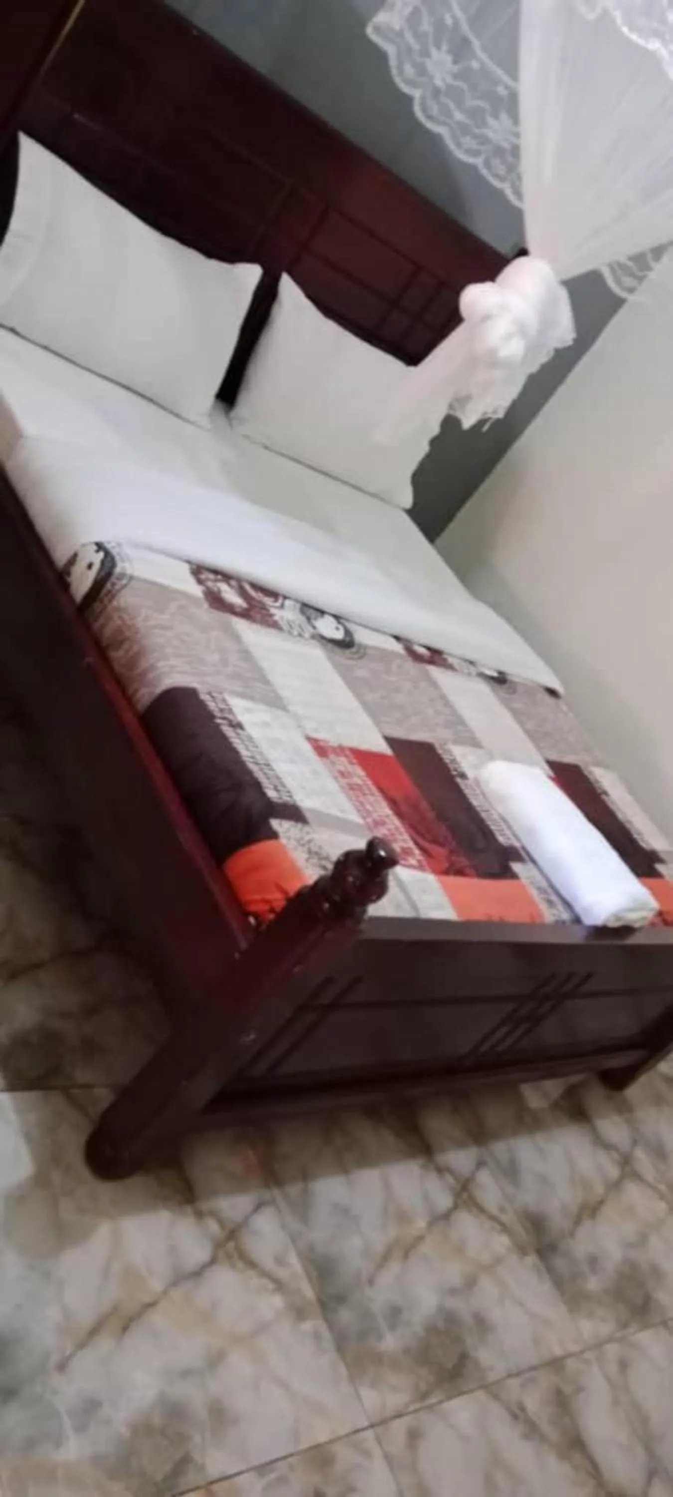 Bed in Gorilla African Guest House