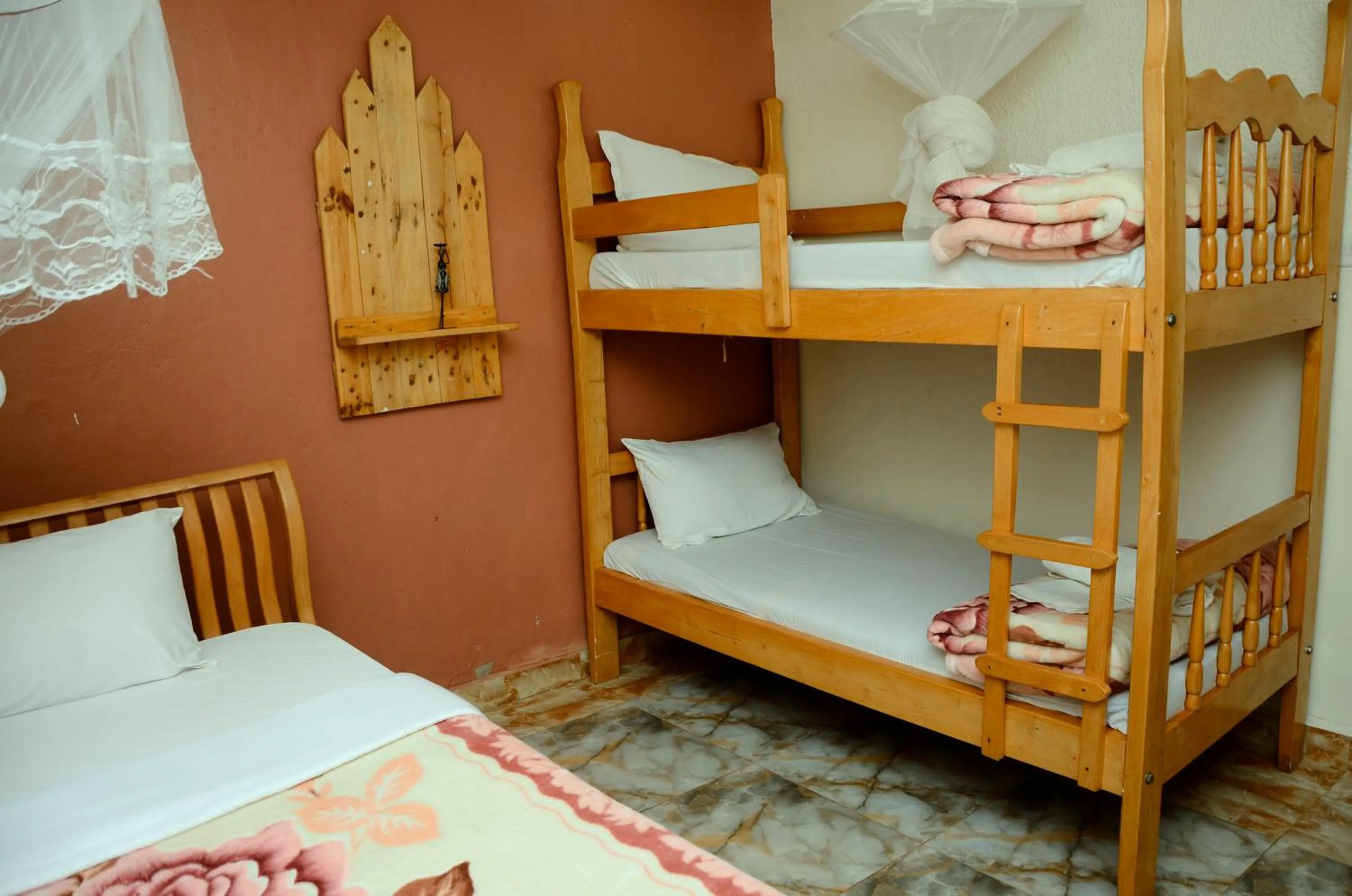 Bed in Gorilla African Guest House